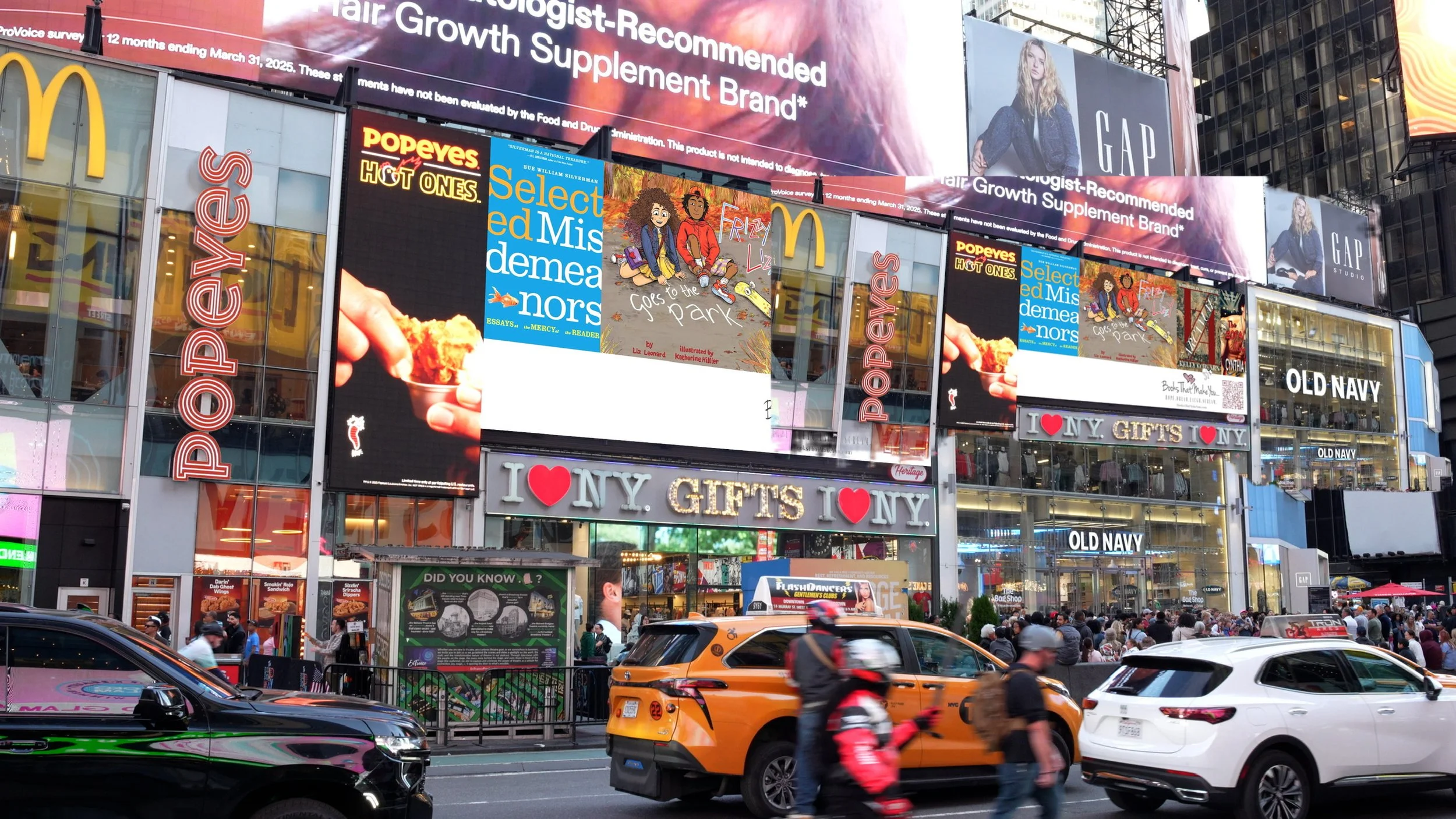 A busy city street with large electronic billboards advertising various brands, including Popeyes, McDonald's, and Gap, with cars, taxis, and pedestrians navigating the scene.
