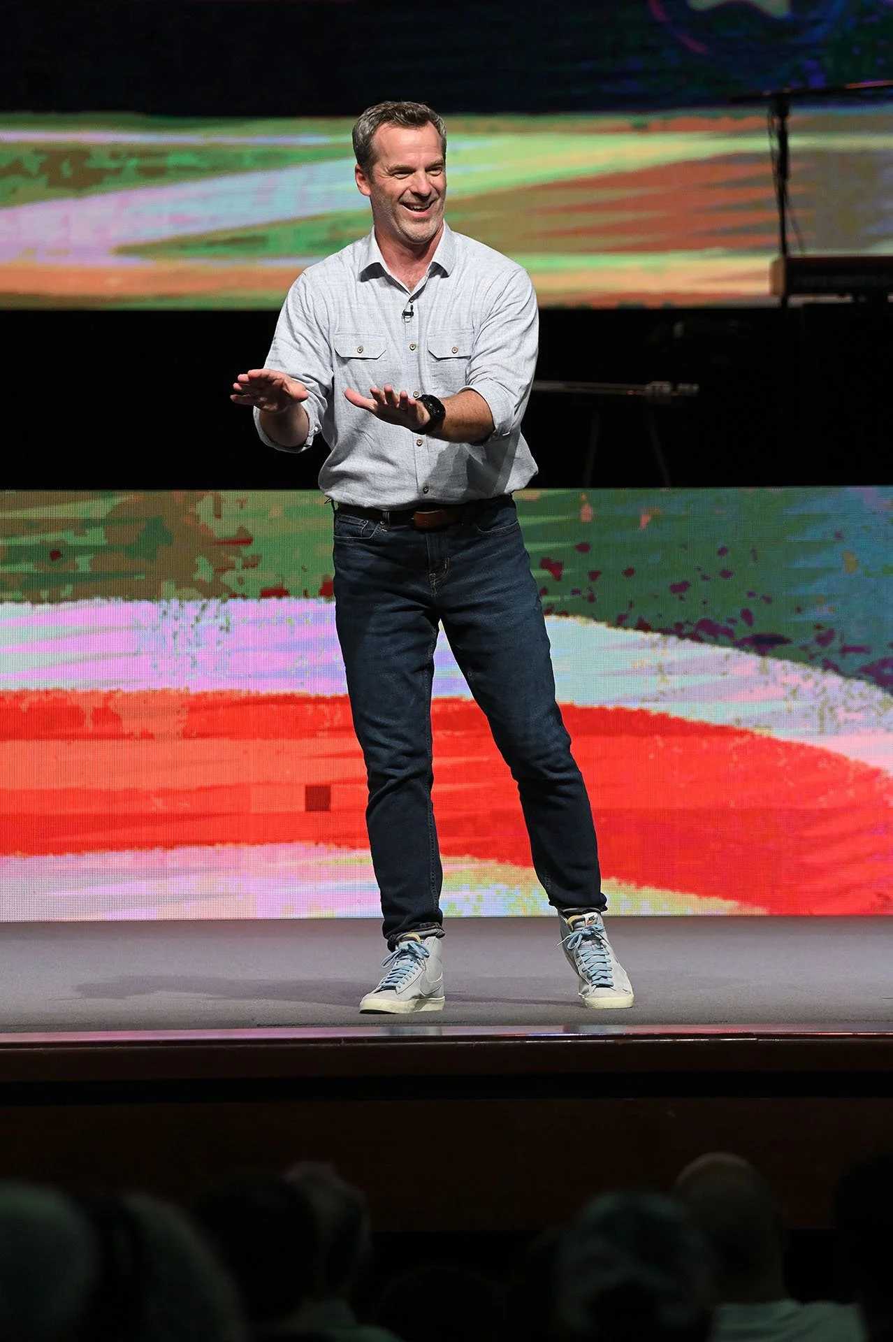 Pastor Shawn smiling while preaching an engaging sermon.