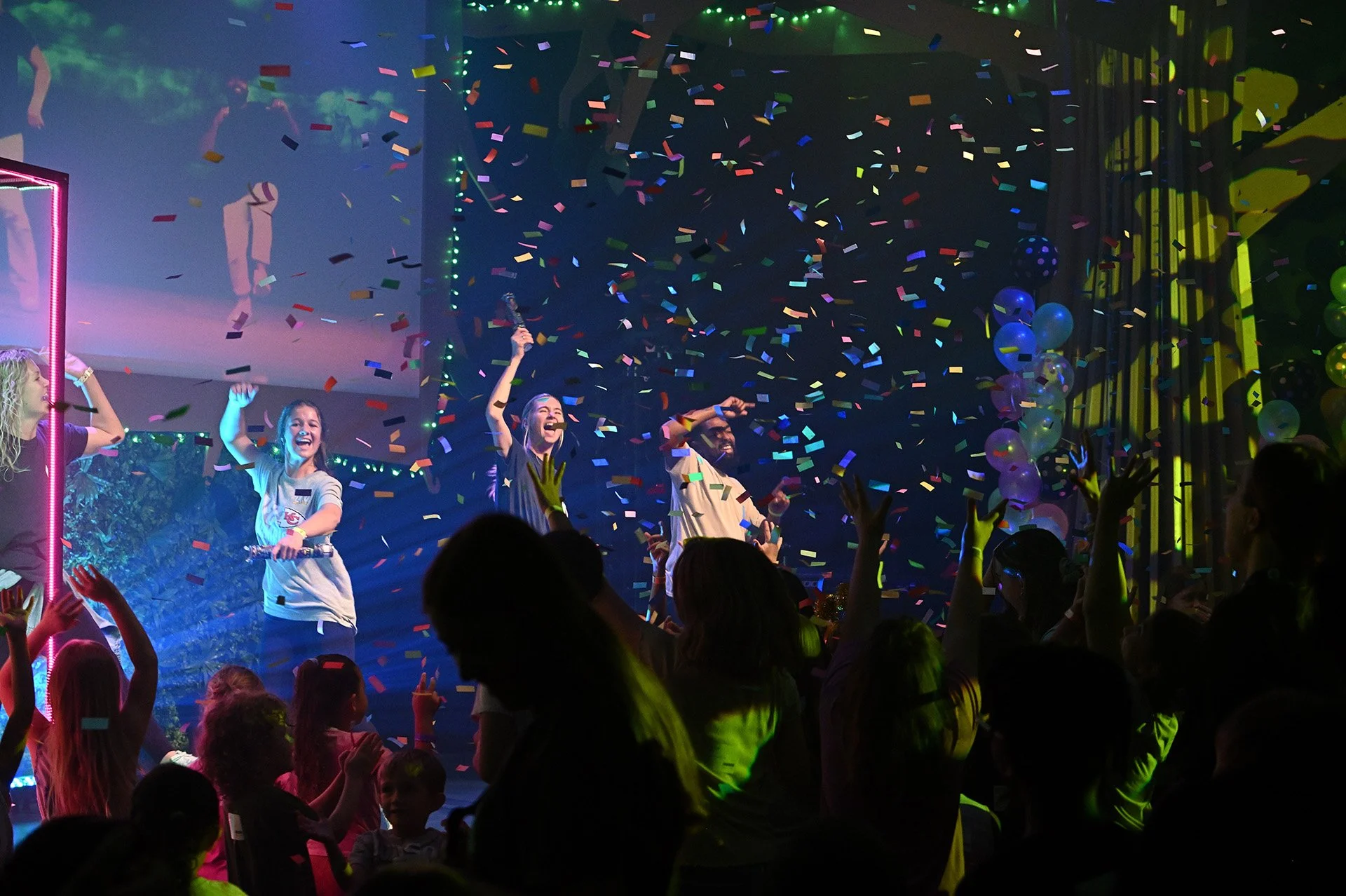 Confetti falling on a group of children during a Jr. Kids service.