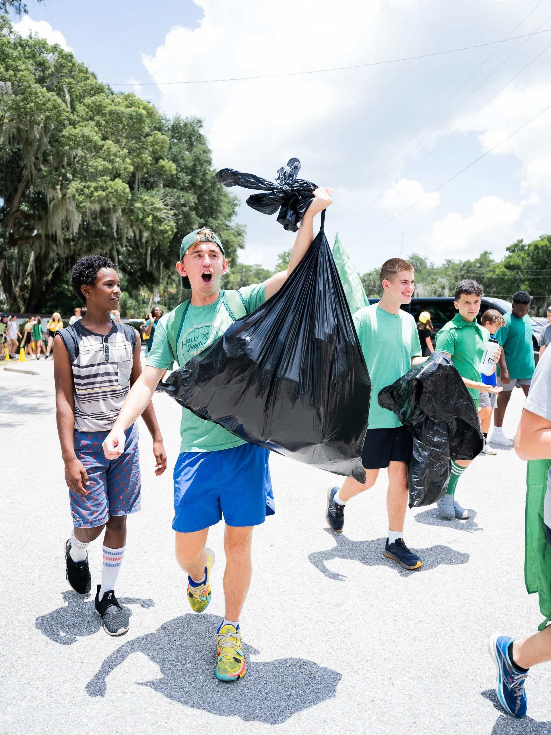 Young adults picking up trash within their community