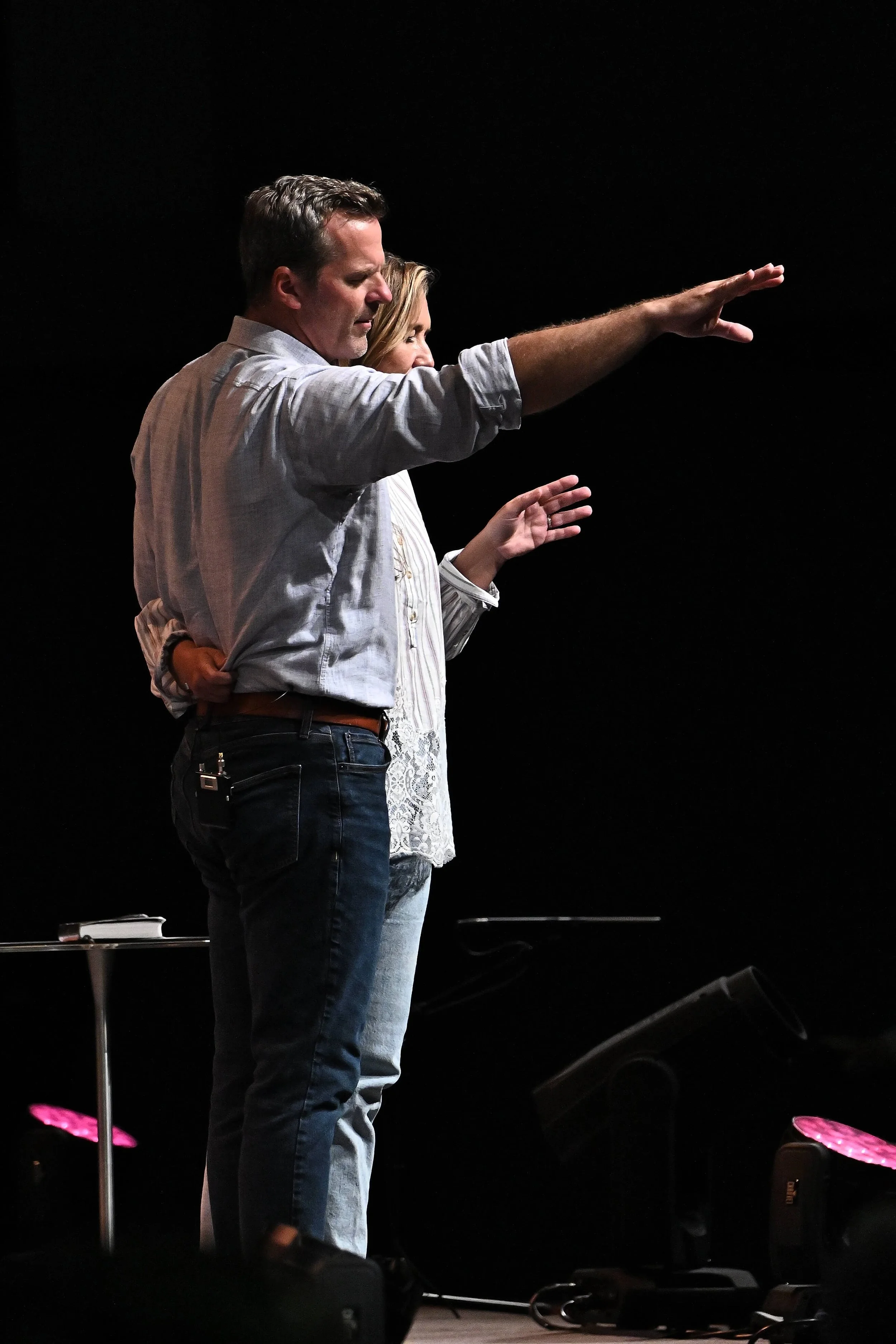 Pastor Shawn and his wife praying over the Family Worship Center congregation.