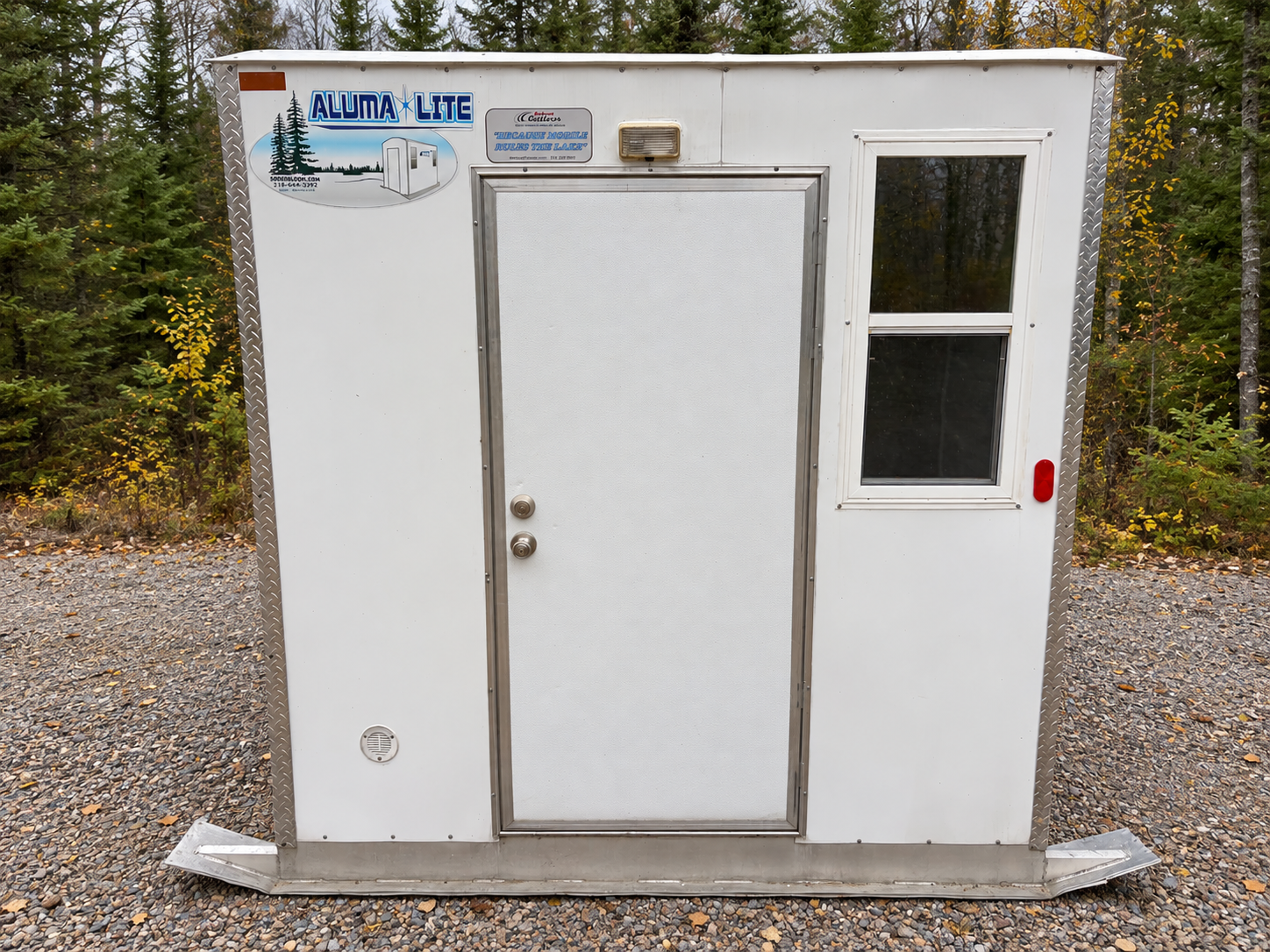 Aluma Lite Fish House in Northern Woods.png