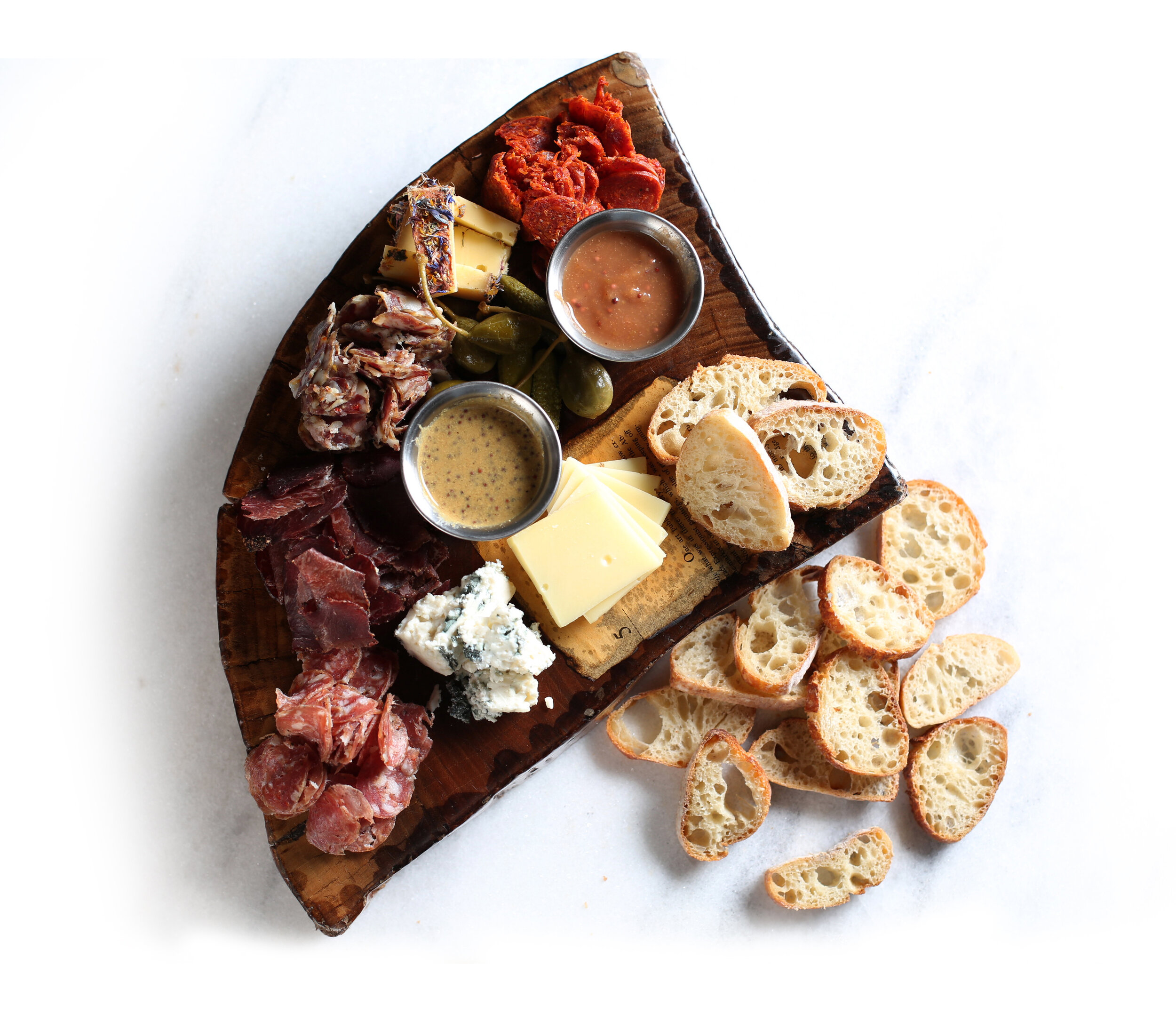 Charcuterie board from Bluebeard, with bread from Amelia’s Bakery, its sister restaurant next door. Courtesy Bluebeard.