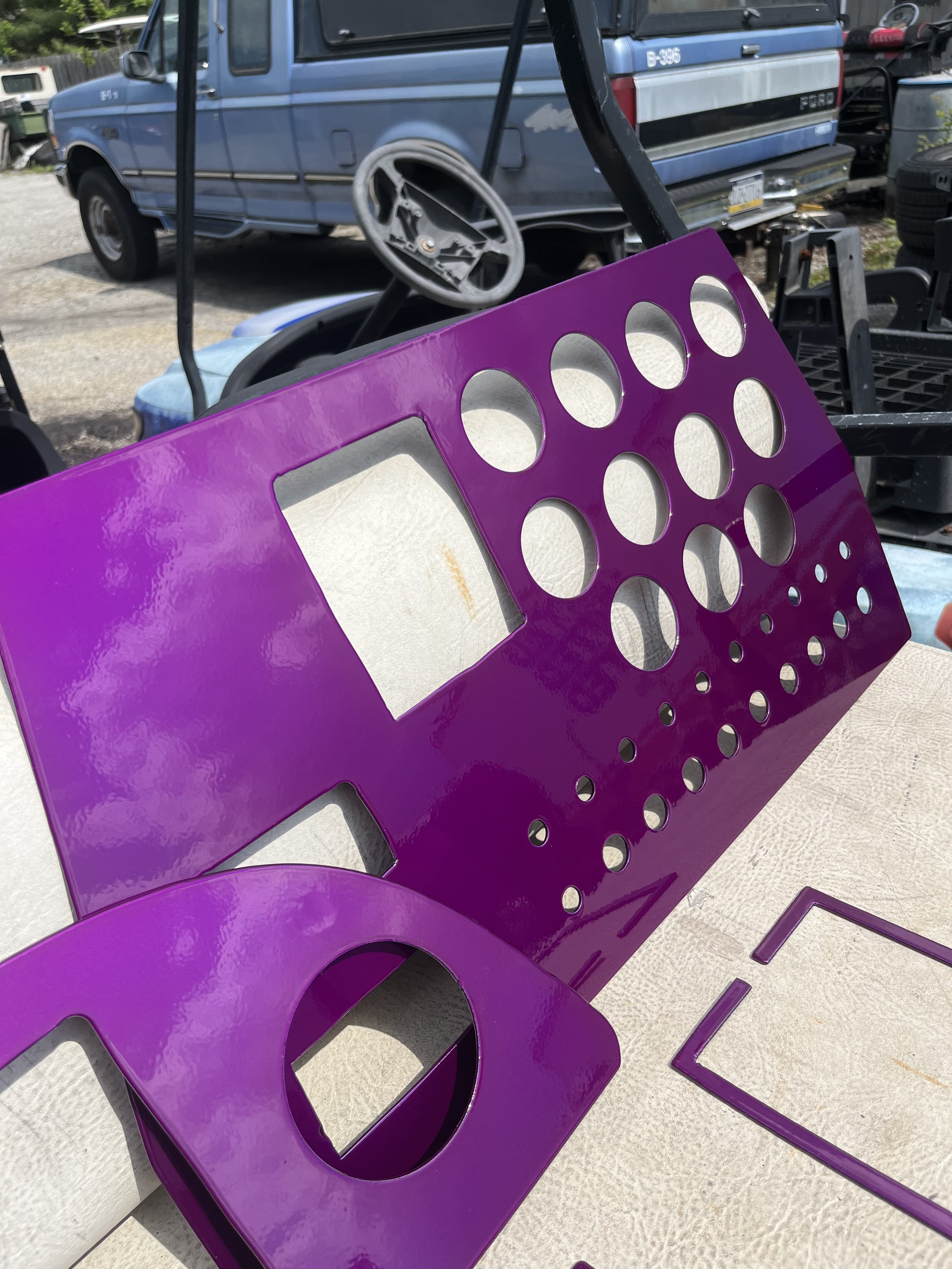 Purple aluminum gauge clusters powder coated for a boat dashboard in Kennett Square PA