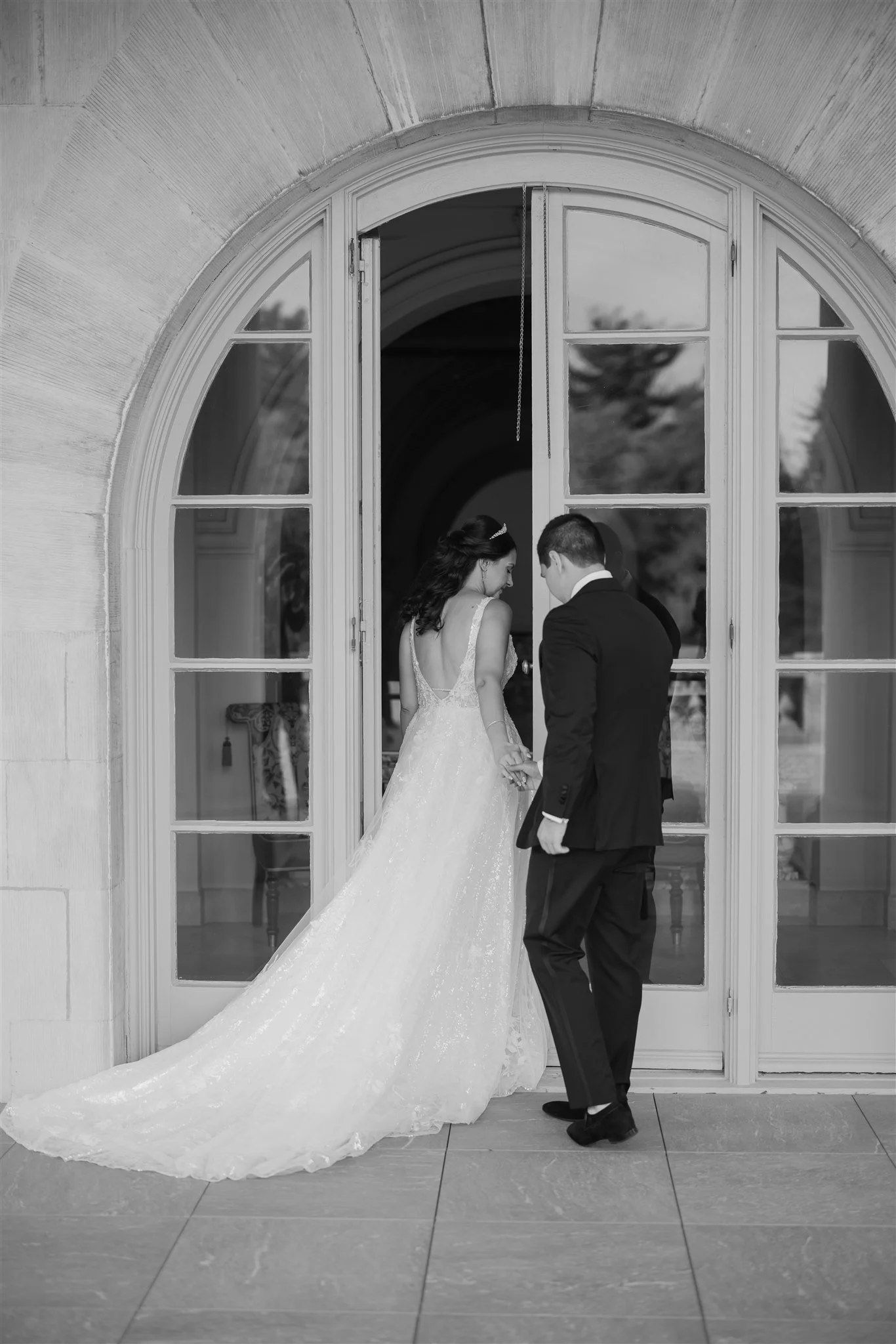 Laurie’s customers, Fernando and Kate embracing by the lake on their wedding day.