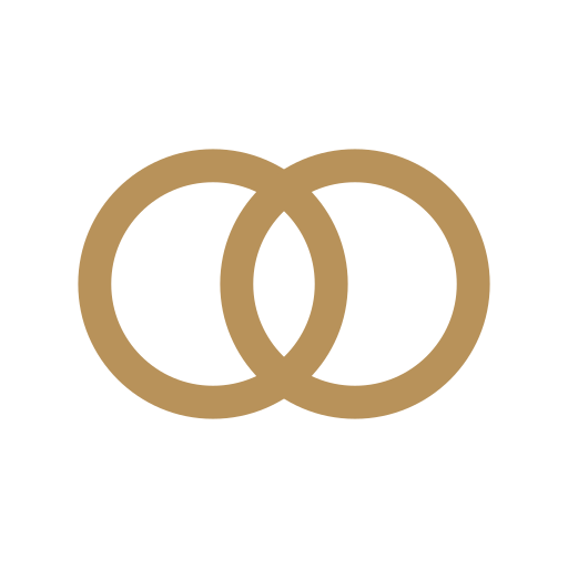 Two overlapping gold rings on a black background.