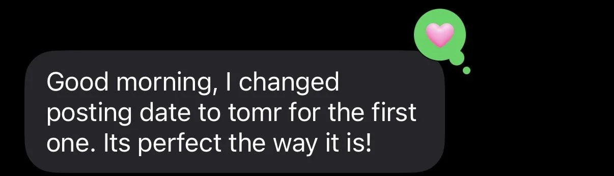 A screenshot of a messaging app showing a conversation with a gray speech bubble containing a text message. The message reads: 'Good morning, I changed posting date to tomorrow for the first one. Its perfect the way it is!'. There is a green circle with a pink heart icon on top right of the speech bubble.