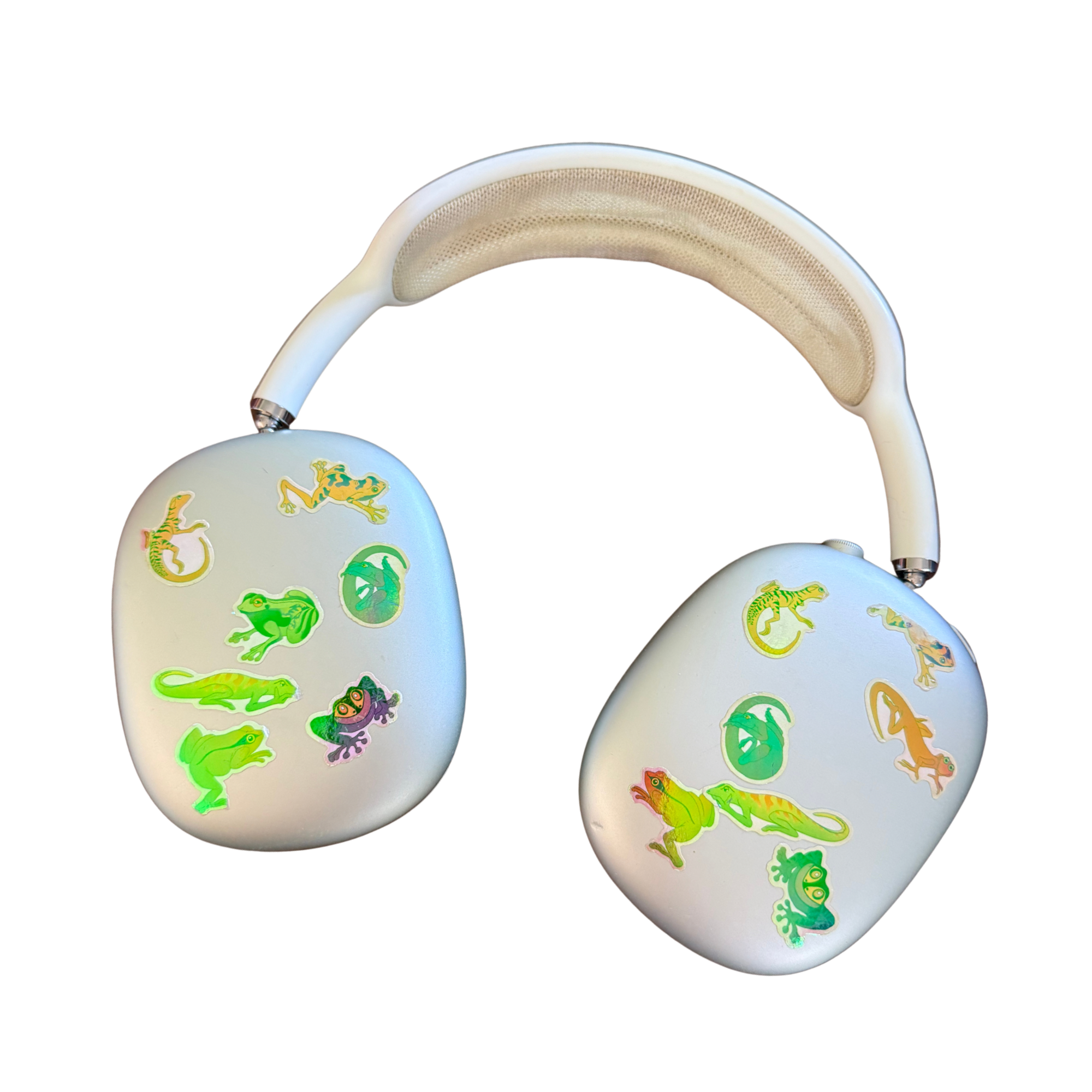Close-up of a white teething ring with dinosaur stickers, featuring a beige silicone teething surface on top.