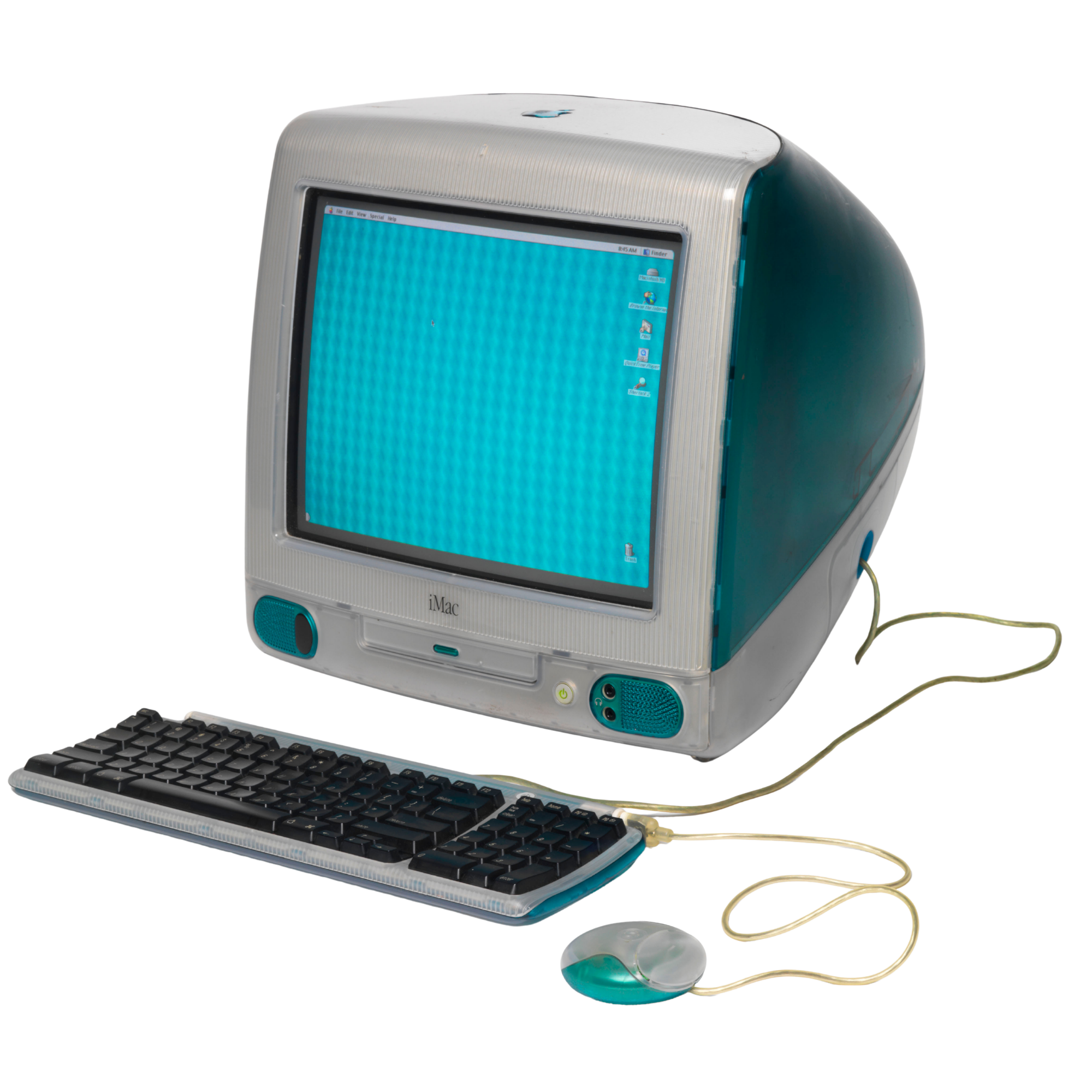 An old Apple iMac computer, keyboard, and mouse.