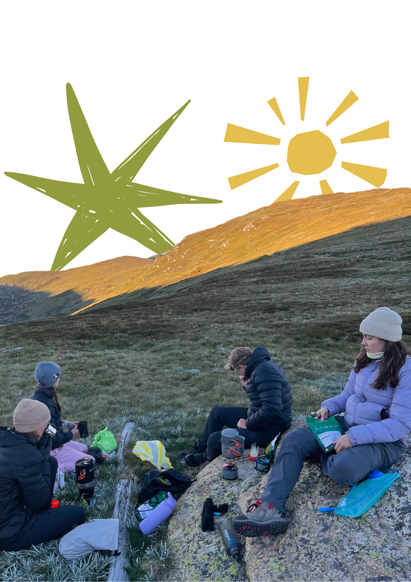 Group of people sitting on grass in a mountainous area during sunset, with some preparing camping gear.