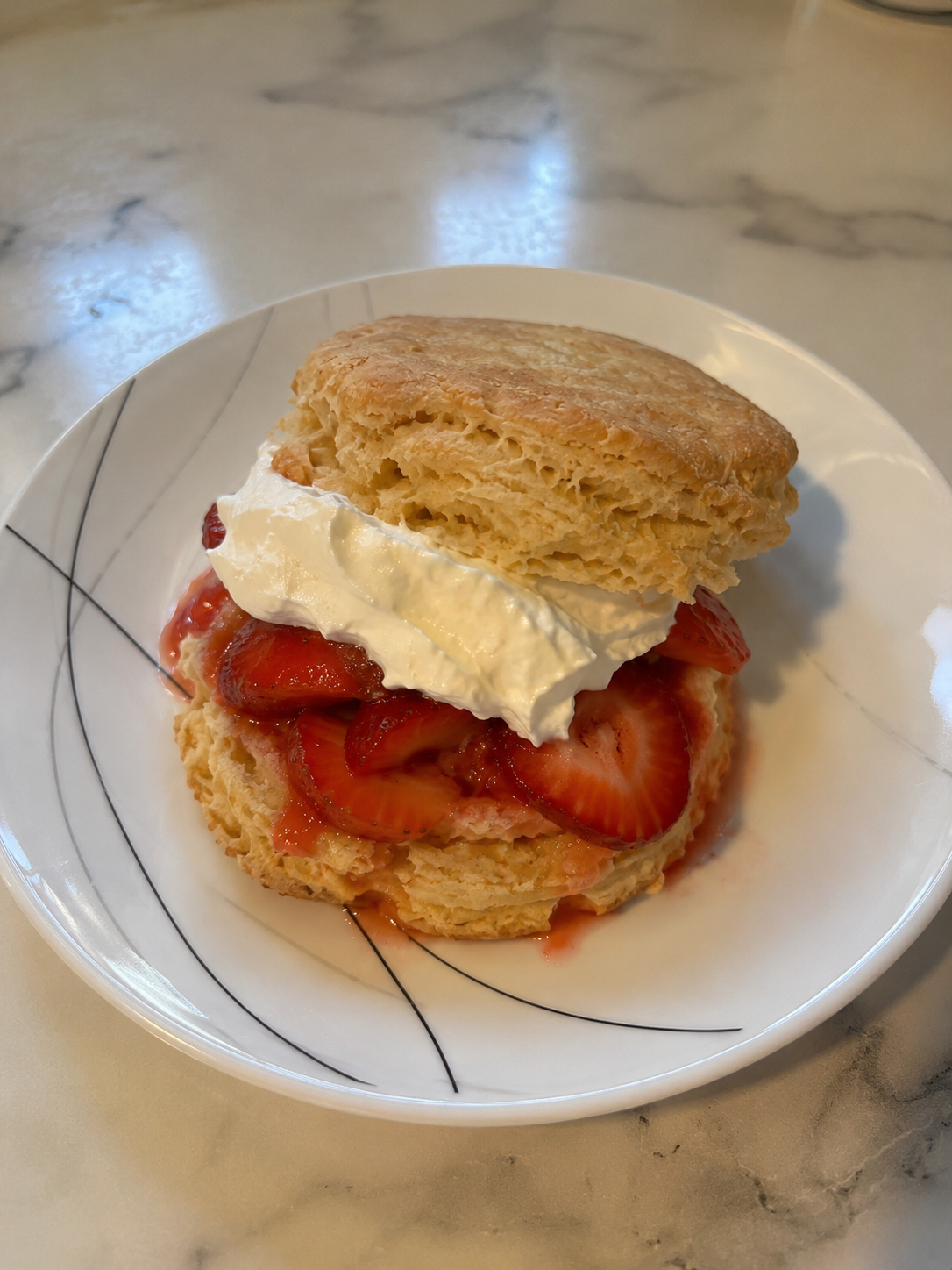 Fresh-milled flour strawberry shortcake made with homemade biscuits, strawberries, and whipped cream.