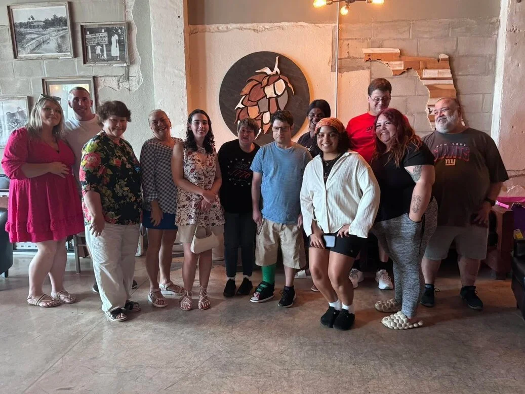 Group photo of Breakthroughs LLC staff and clients.