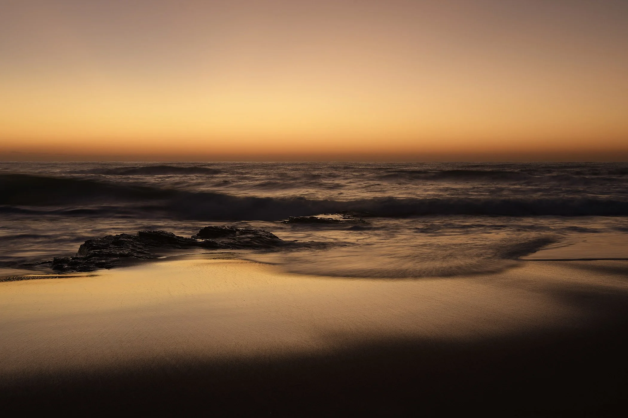 Abstract beach views show amazing glows of dawn over the African coastline