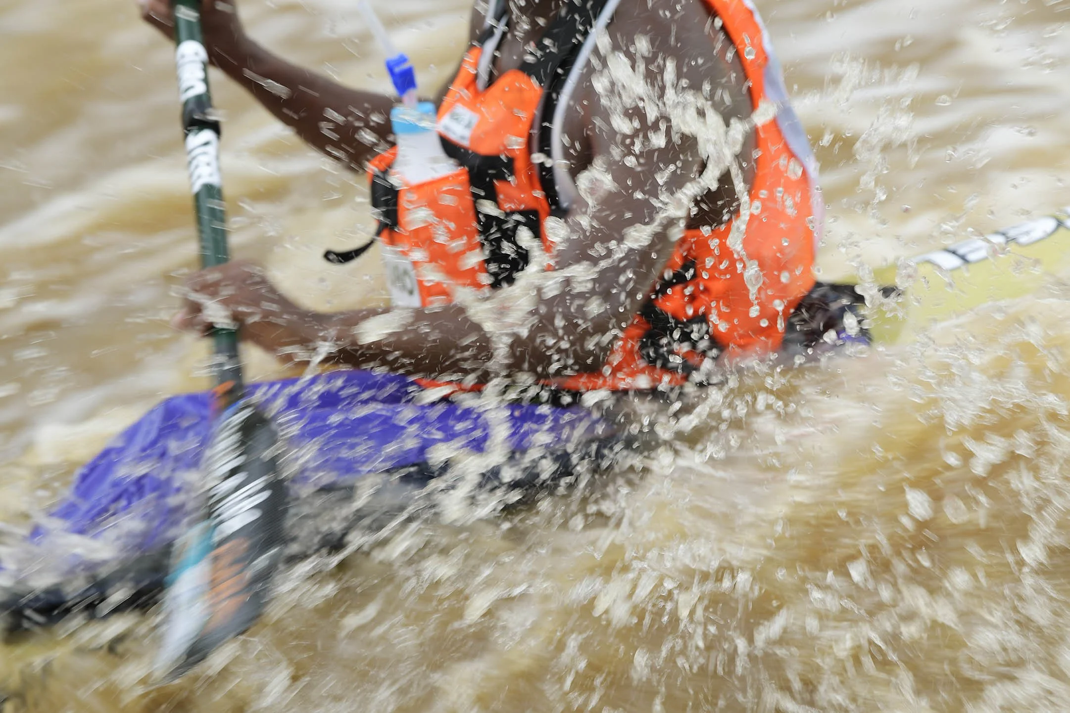 Close up sports action of competitor paddling in Duzi canoe marathon