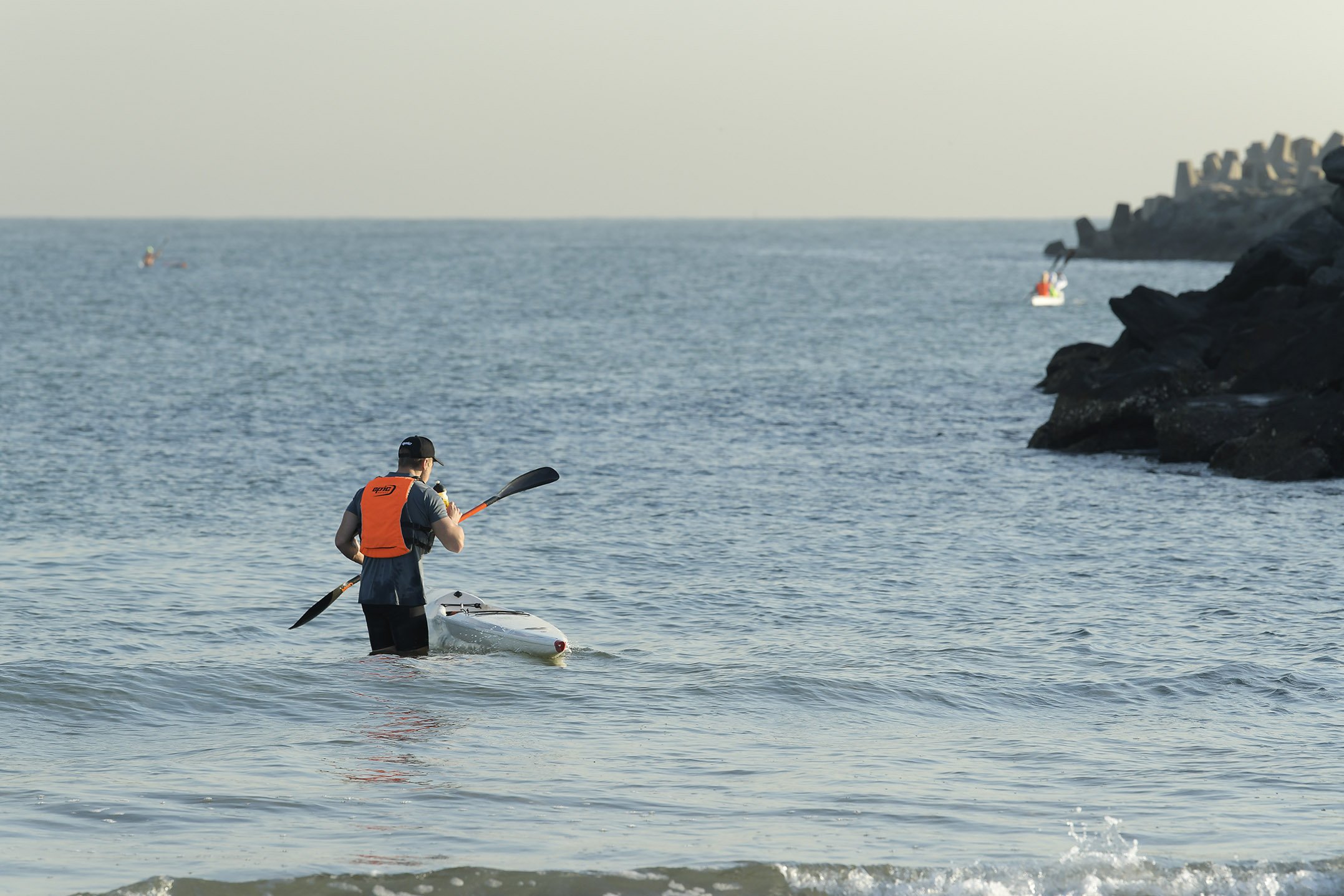 Open water paddler preparing to launch his canoe at Point Beach, Durban