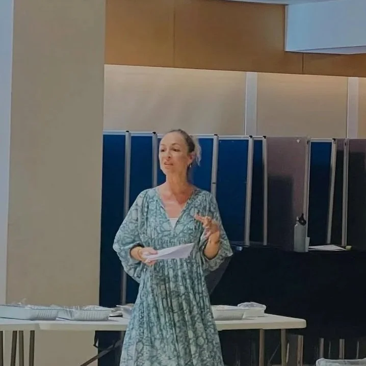 A woman in a patterned dress presenting CPD