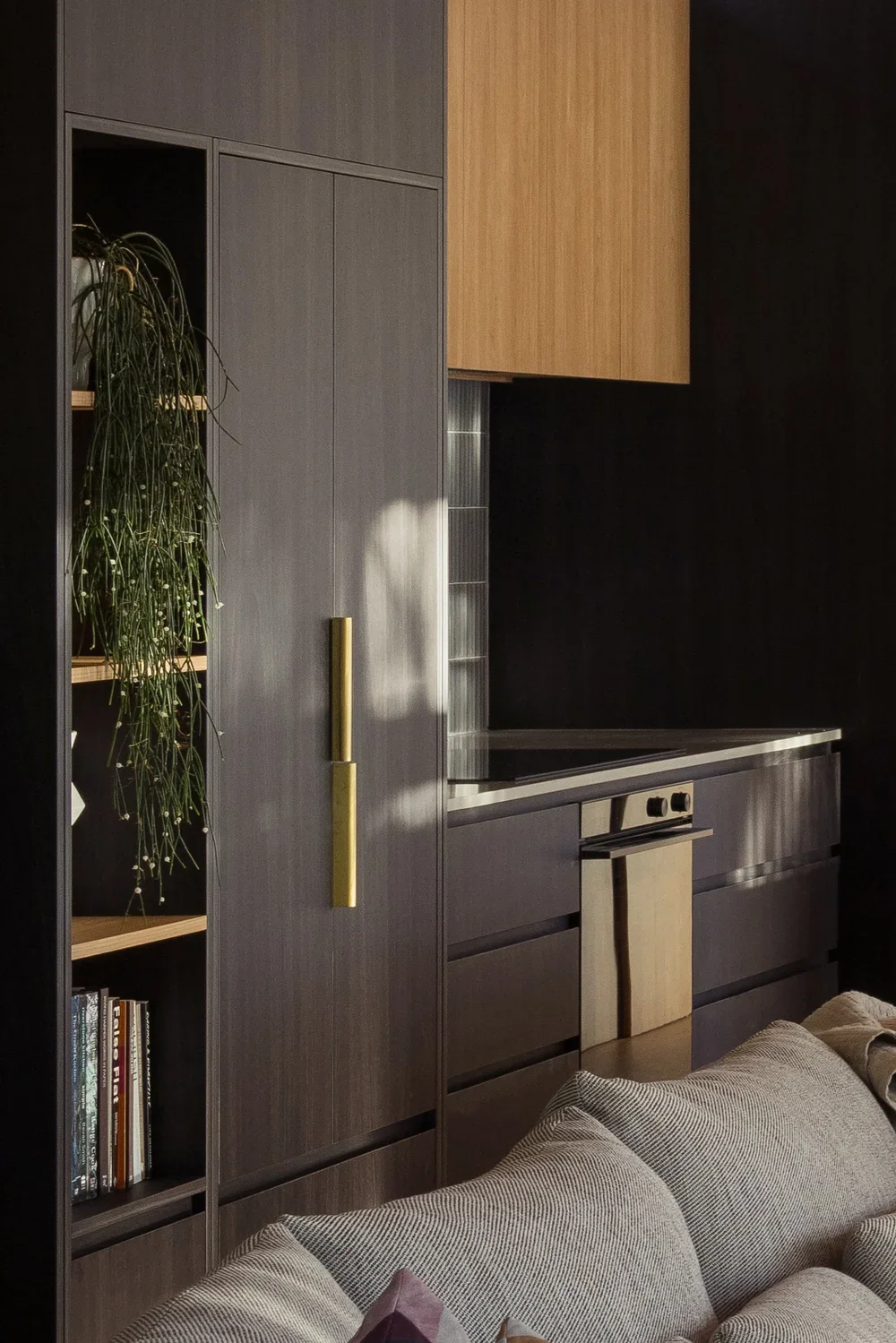 Bespoke timber cabinetry paired with a refined natural material palette.webp