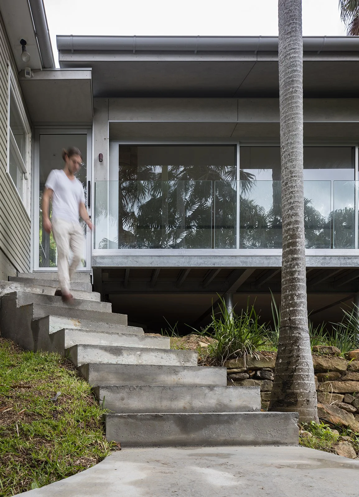 Grey fibre cement cladding and metal roof exterior.jpg