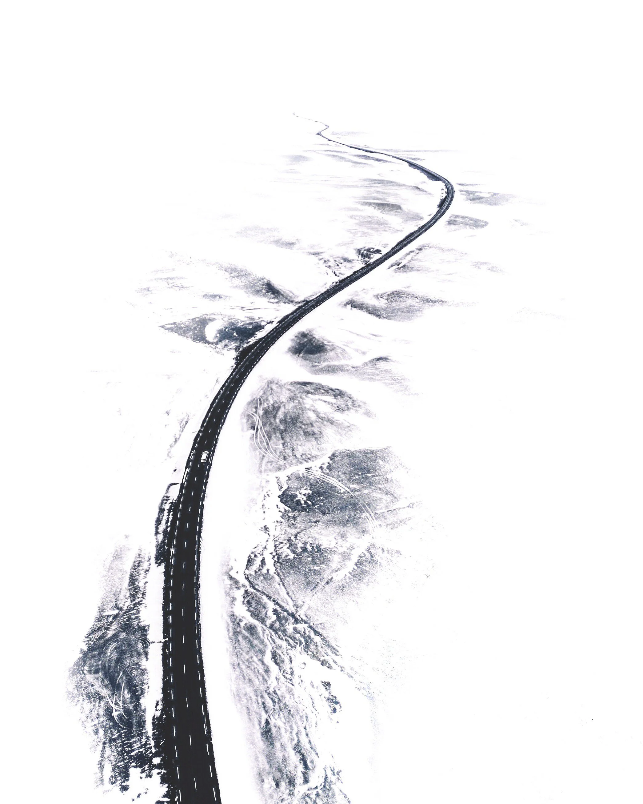 Winding road through a snow-covered landscape