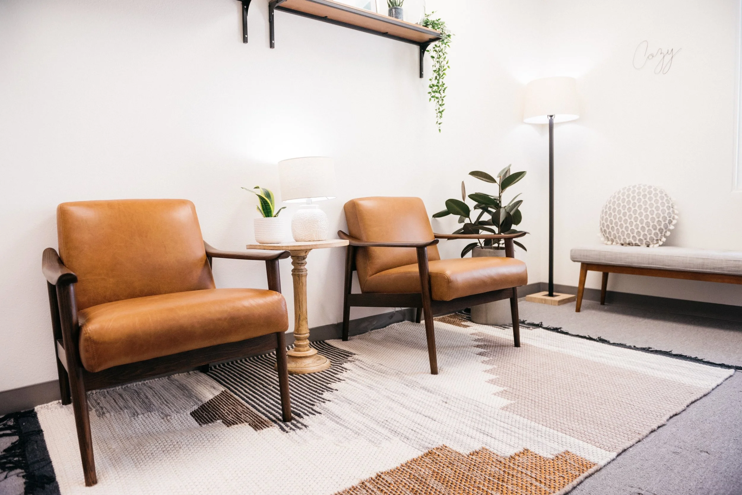 Two leather armchairs in a calm, bright room