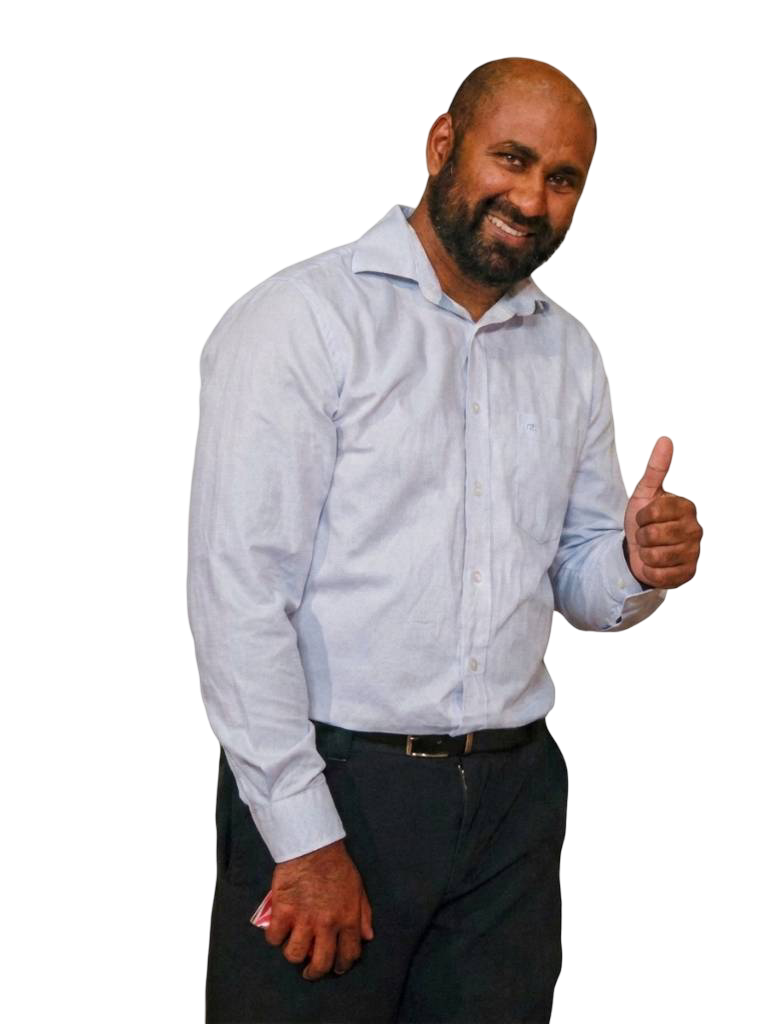 Edmond Jodhi semi-casual full body giving the thumbs up.