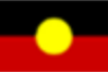 Flag of Aboriginal Australia with horizontal black, red, and yellow colors, and a central yellow circle