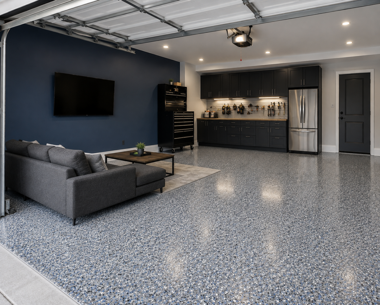 A modern garage with an industrial-style, custom epoxy floor, new paint job, and designed as a man cave.