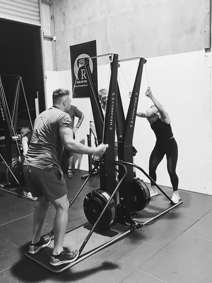 Women training together during a Rise Up Fitness group class