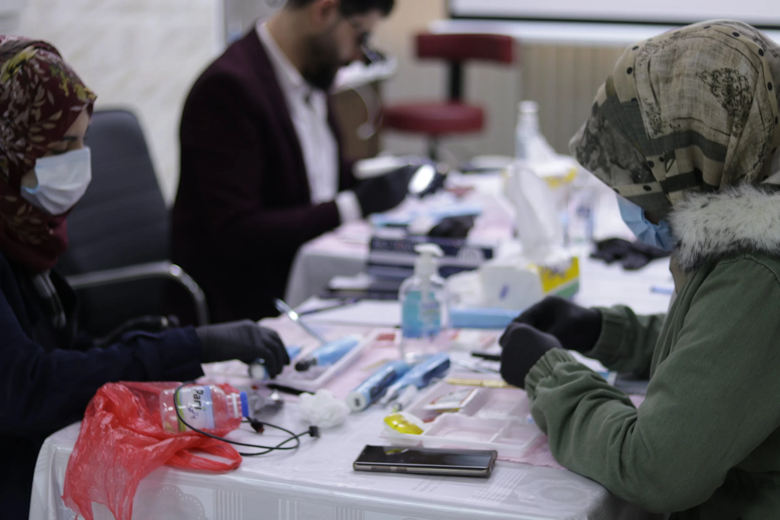 Delegates practising endodontic techniques during a hands-on course