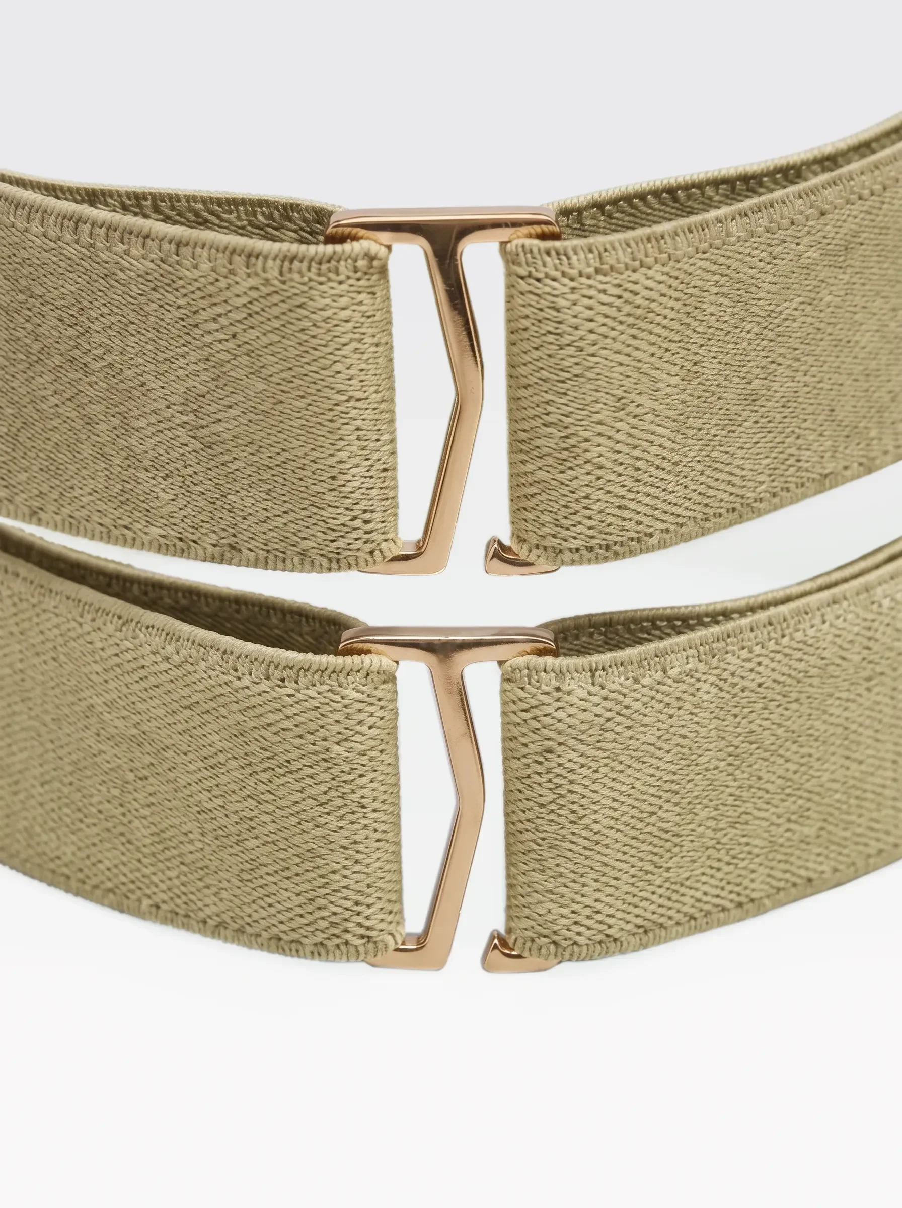 Close-up of the 24K gold-plated brass sliders on the pistachio elastic bands of the Sainte Sve V.N.V Croc
