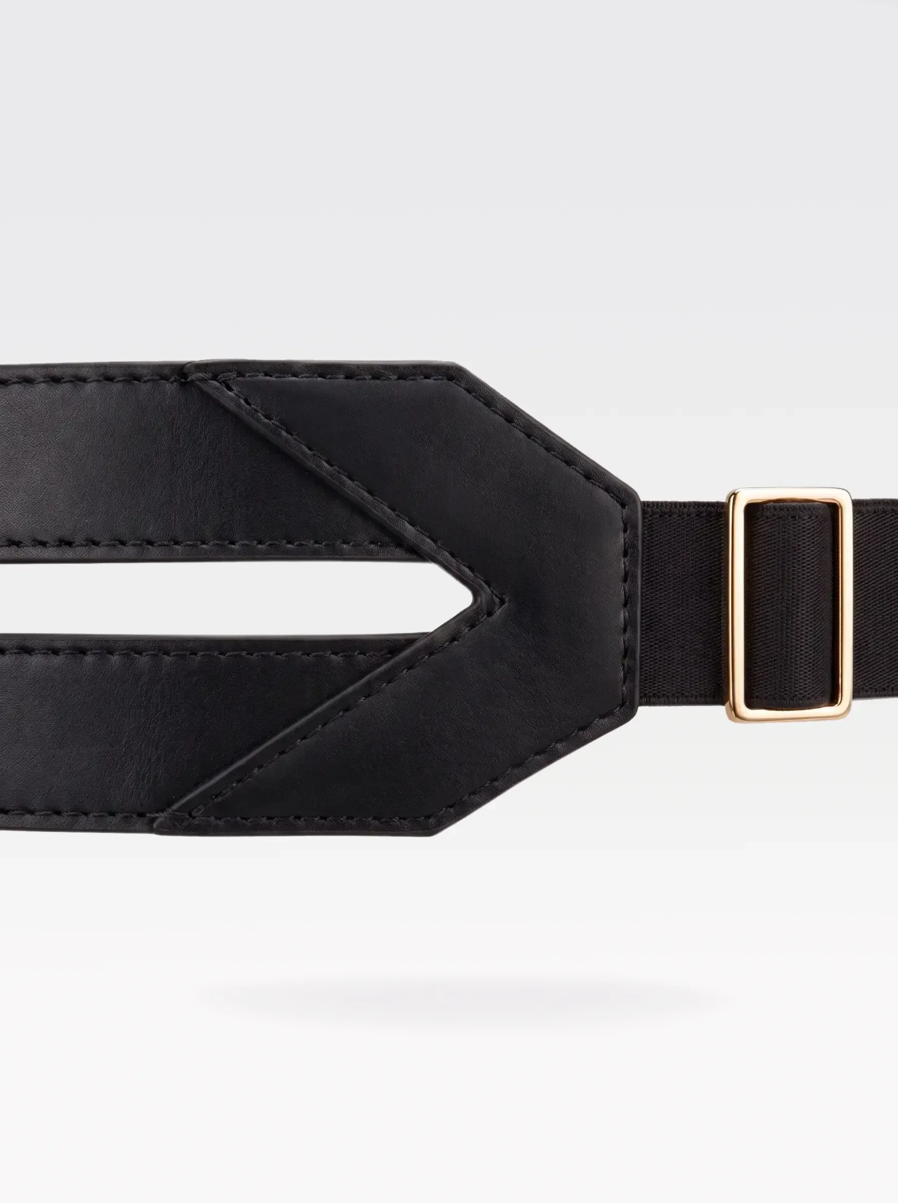 Close-up of the V-shaped black nappa lambskin panel and 24K gold-plated brass slider of the Sainte Sve Belt Nappa