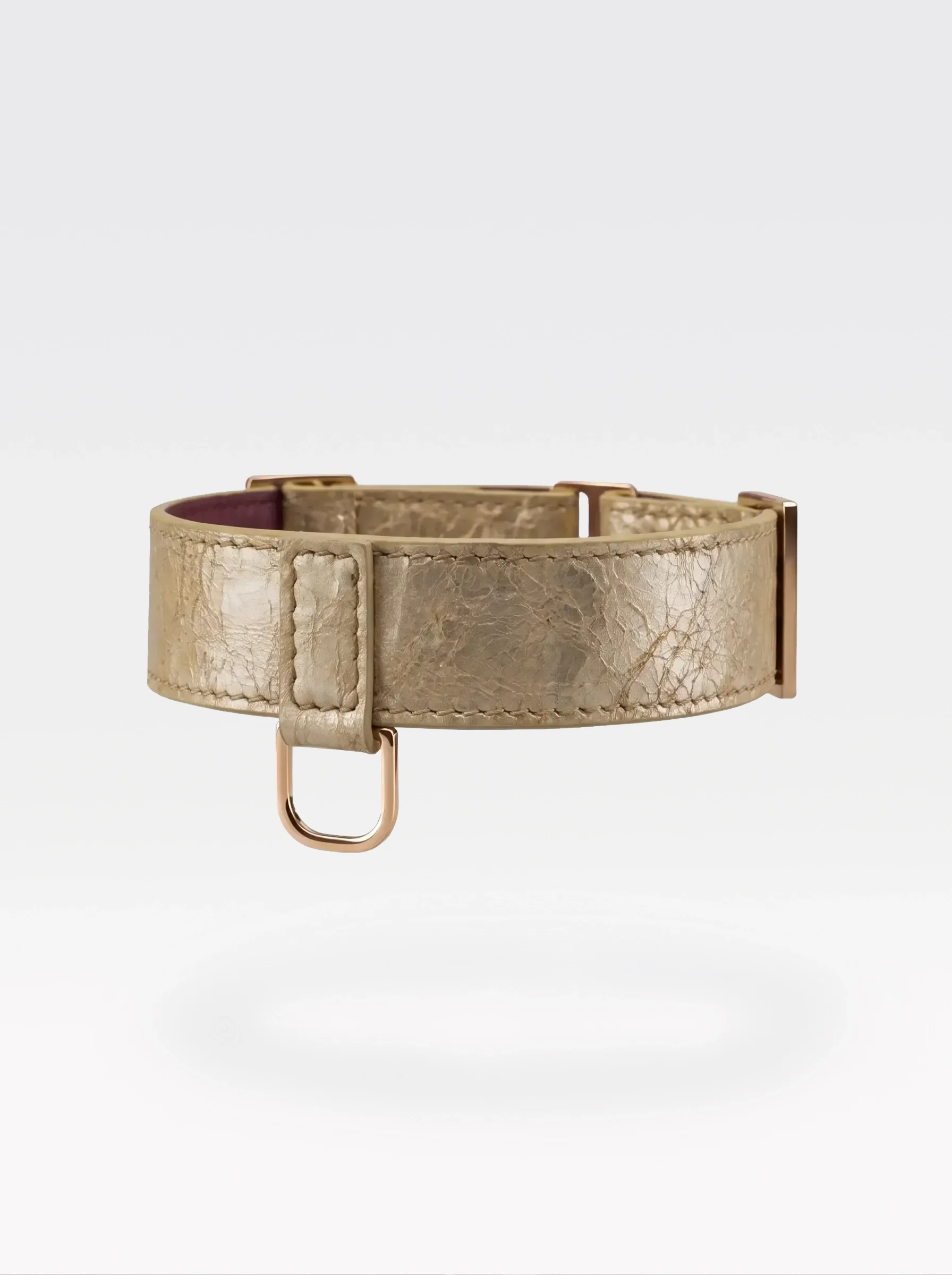Sainte Sve Choker Laminated in gold laminated lambskin with burgundy nappa lambskin lining and a 24K gold-plated brass D ring, side view