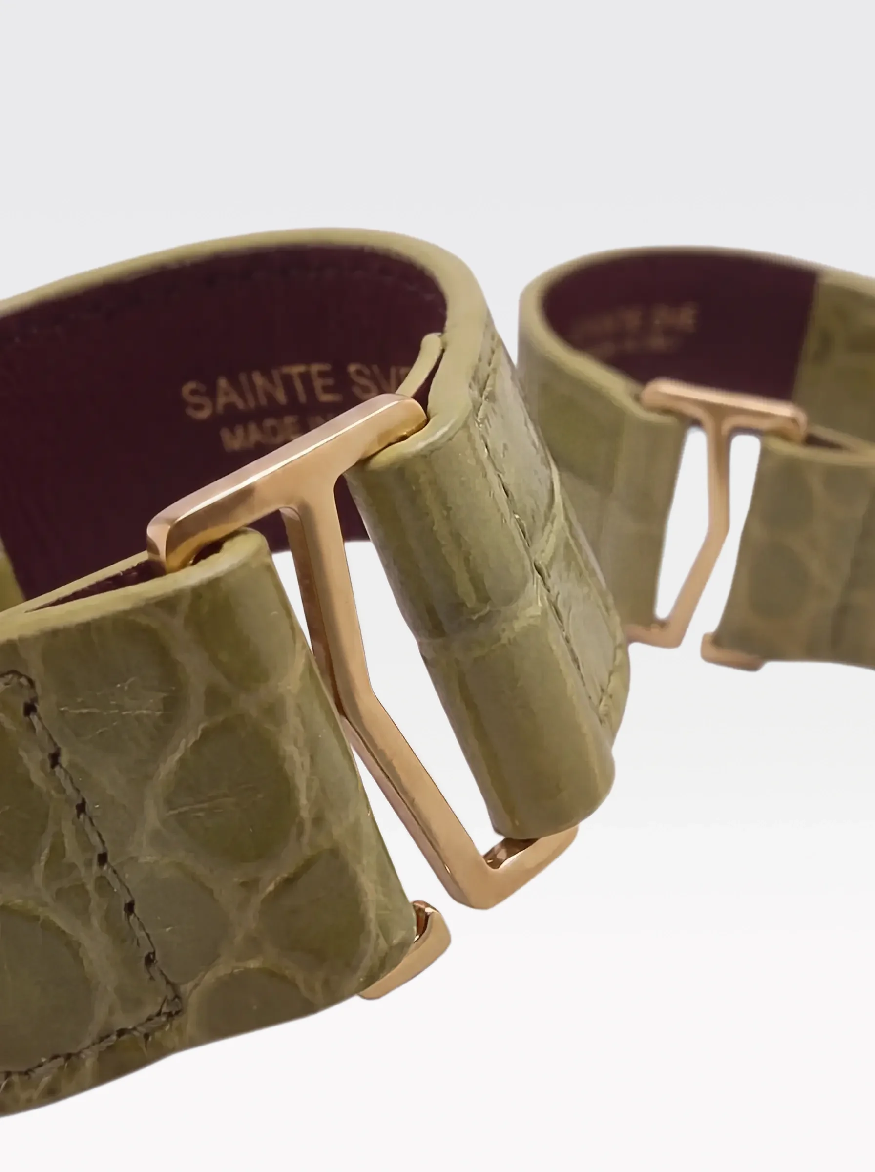 Close-up of the burgundy nappa lambskin lining of the Sainte Sve Ankle Bracelets Croc with the foil-stamped Sainte Sve Made in Italy logo