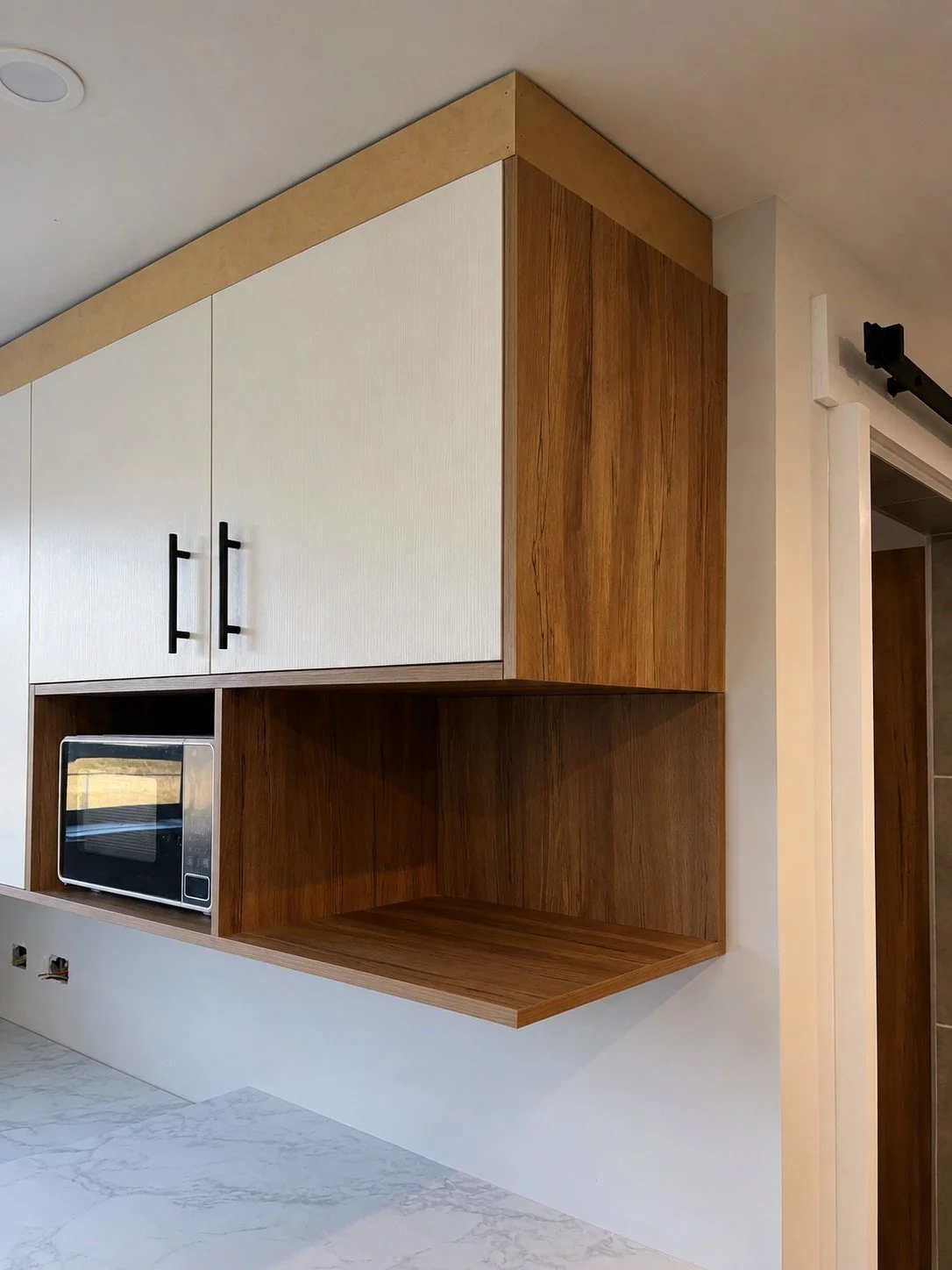 Custom kitchen joinery with Polytec Australian Native Feature shelf.