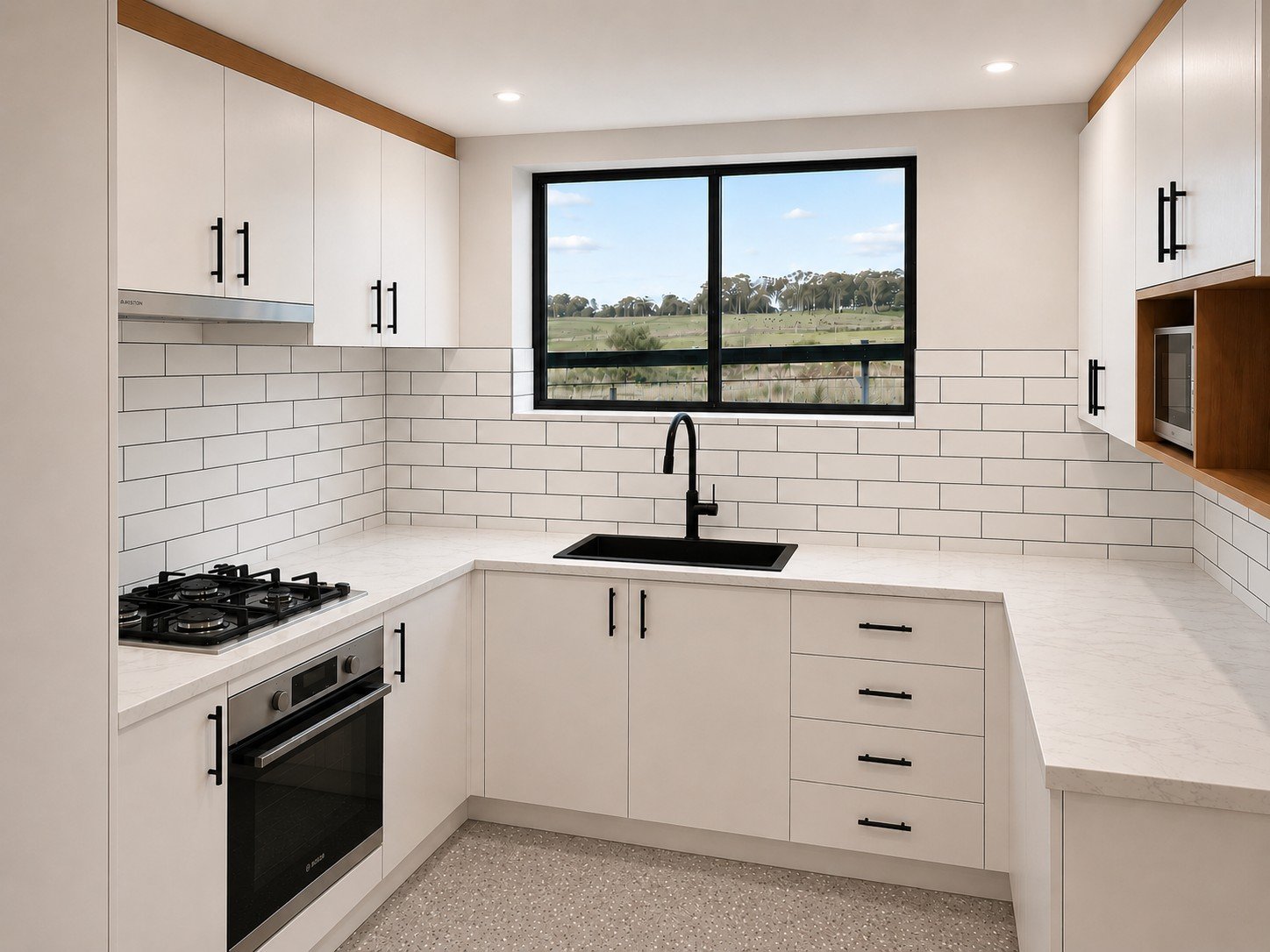 Custom white kitchen with timber feature, black hardware and black sink.