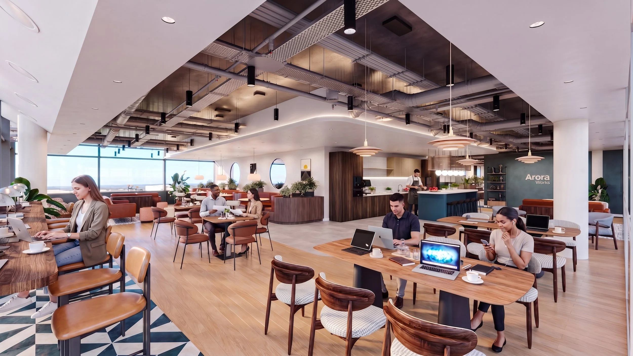 A modern, bright coffee shop with several customers working on laptops or using their phones, and a barista preparing drinks behind the counter.