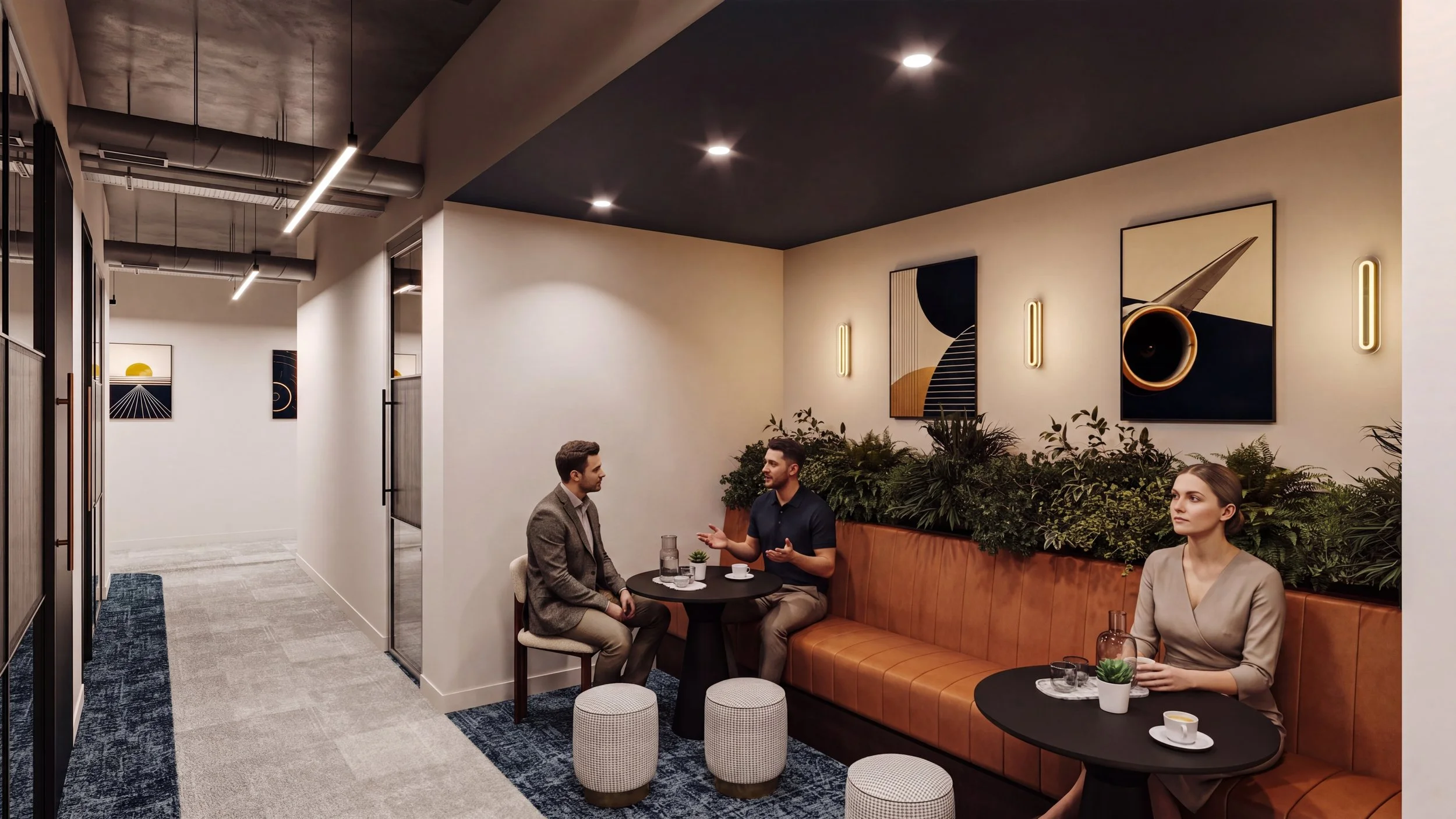 Three people sitting in a modern, stylish lounge area with artwork on the wall, plants, and a mix of seating options, engaging in conversation.