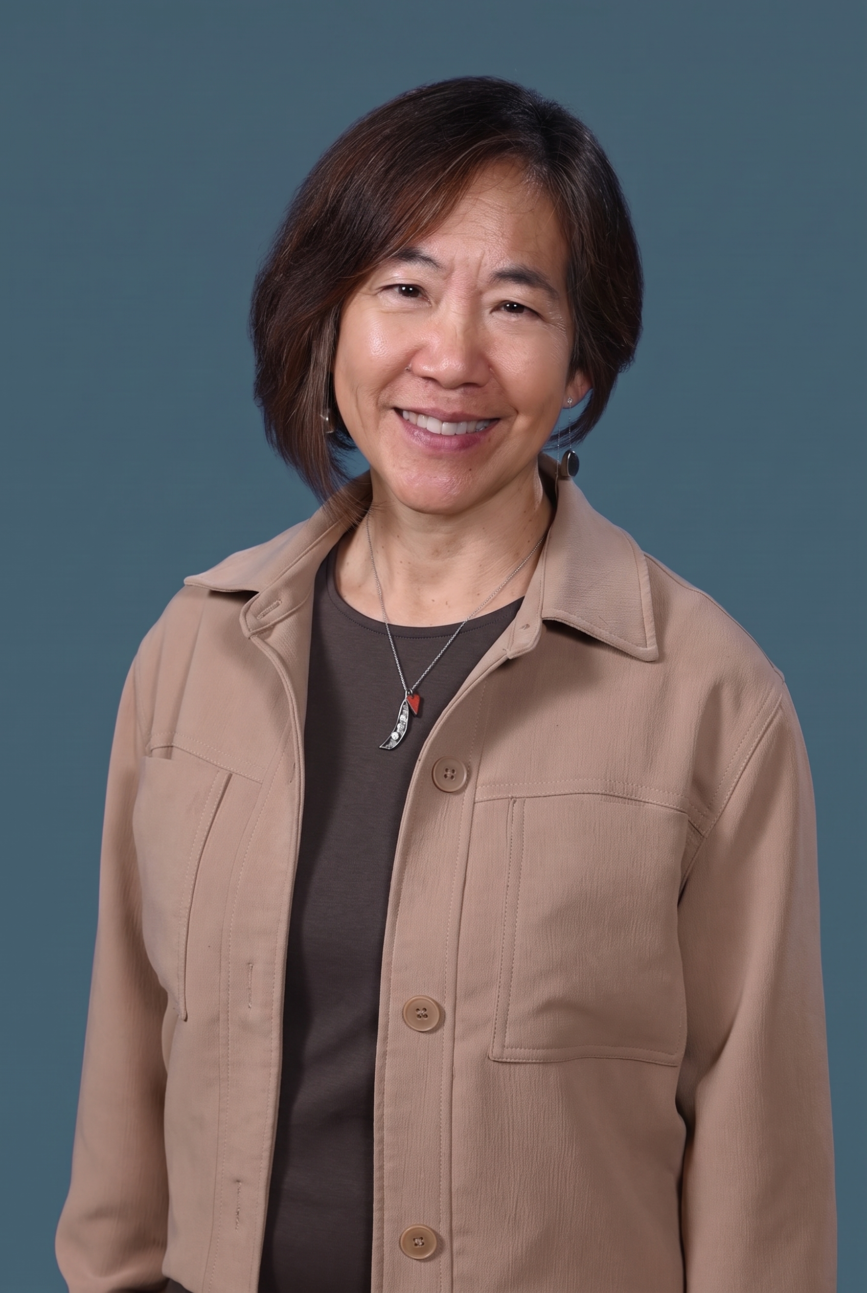 Cindy Au, AI implementation consulting founder at Gold Flow Design, smiling in a professional headshot