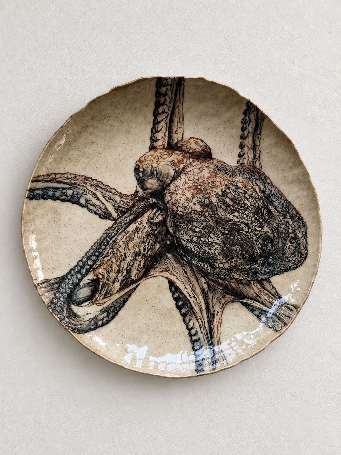 Decorative plate featuring a detailed illustration of an octopus.