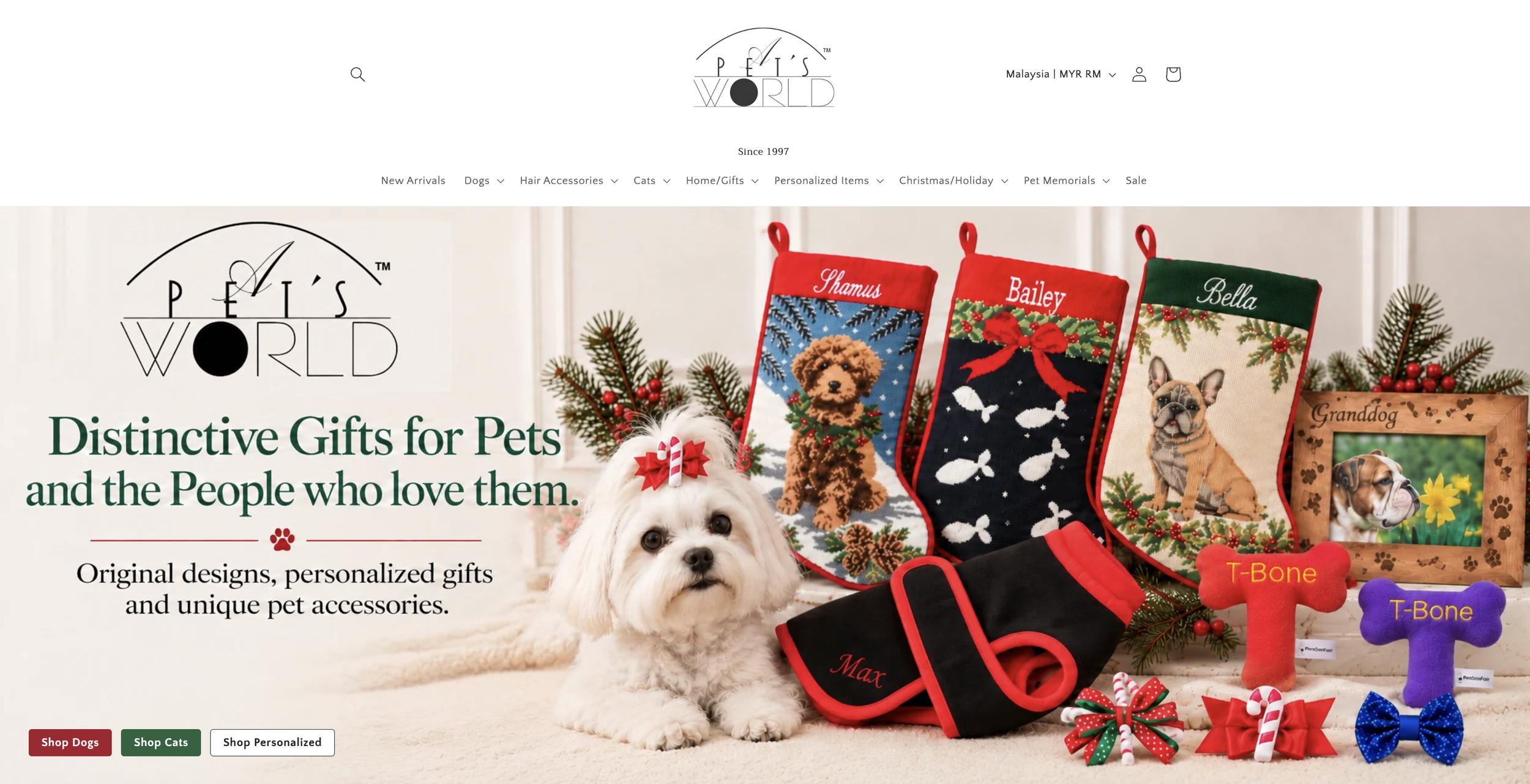 Website homepage for Pet's World showcasing Christmas-themed pet gifts, including stockings with dog designs, personalized pet accessories, and dog treats, with a stuffed dog and Christmas decorations.