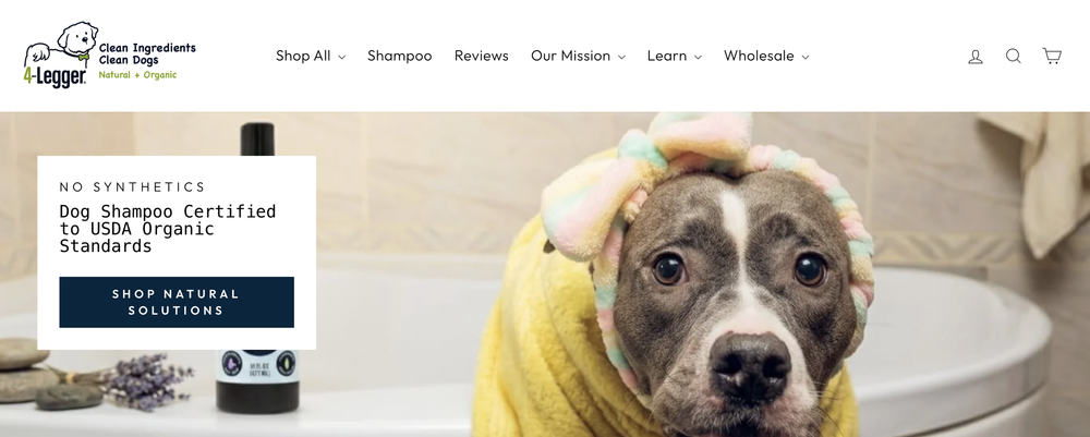 4-Legger website featuring dog shampoo and a dog wrapped in a towel.