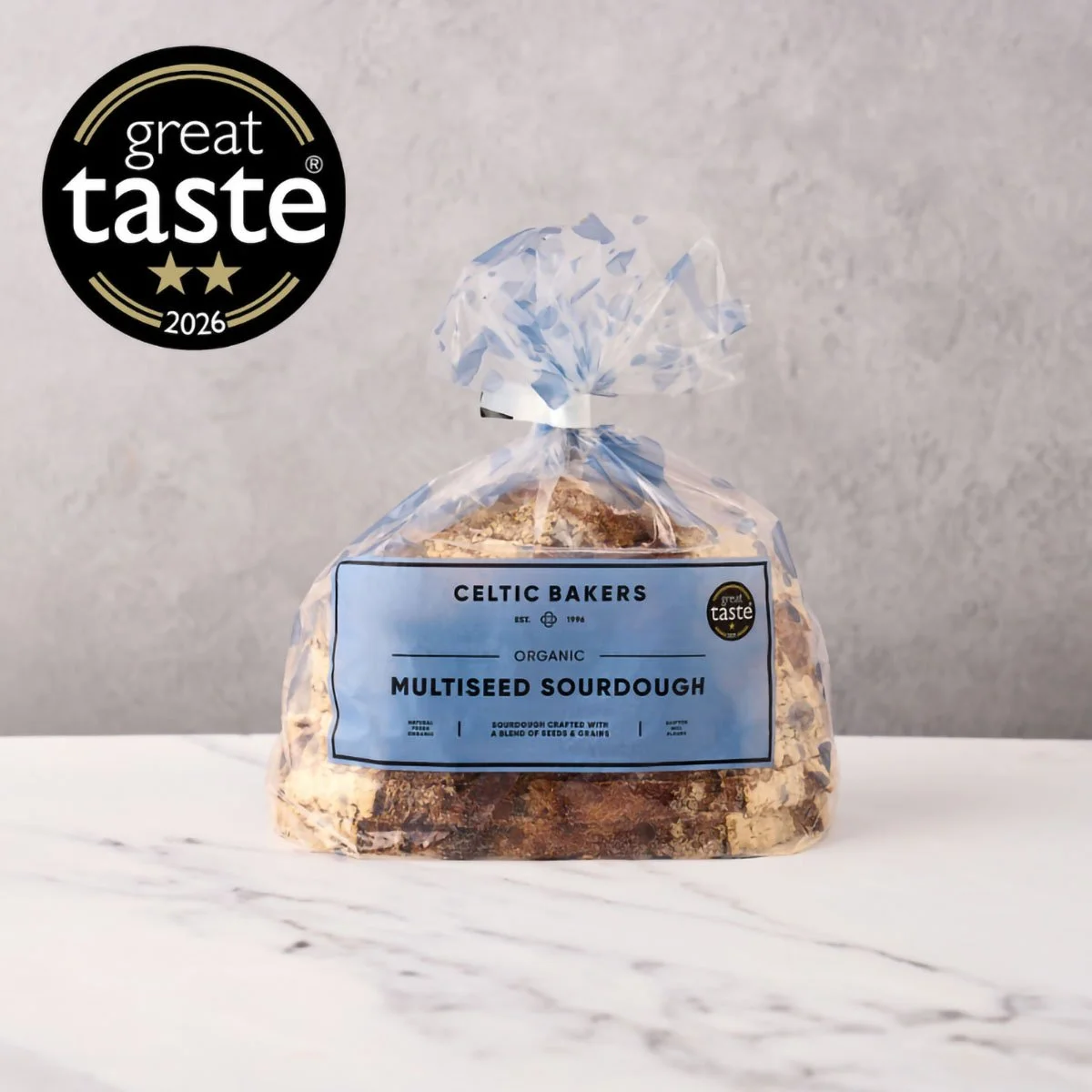A bag of Organic Multiseed Sourdough bread from Celtic Bakers, featuring a Great Taste 2026 award badge on the top left corner.