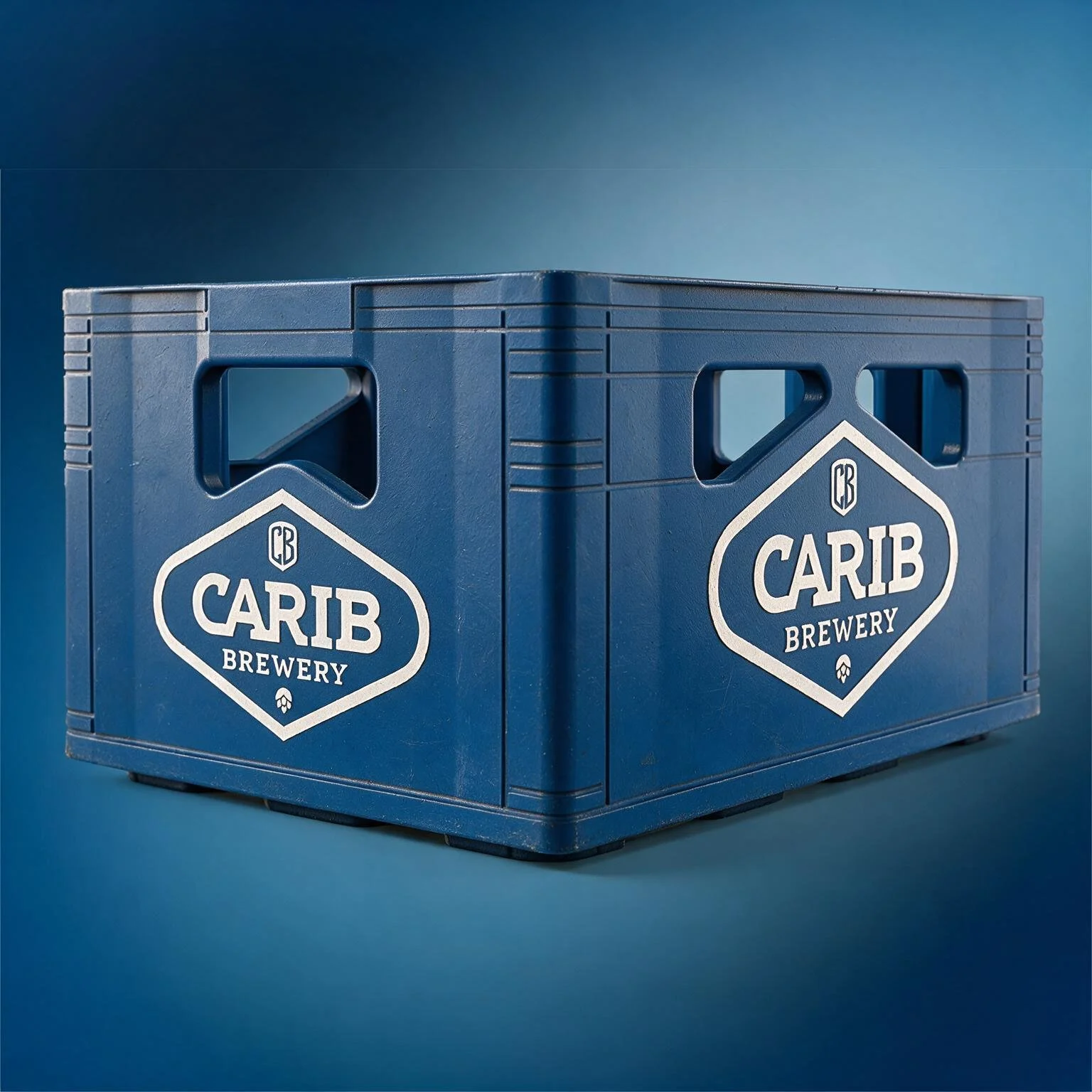 Blue plastic crate with 'Carib Brewery' logo on the side, set against a blue background.