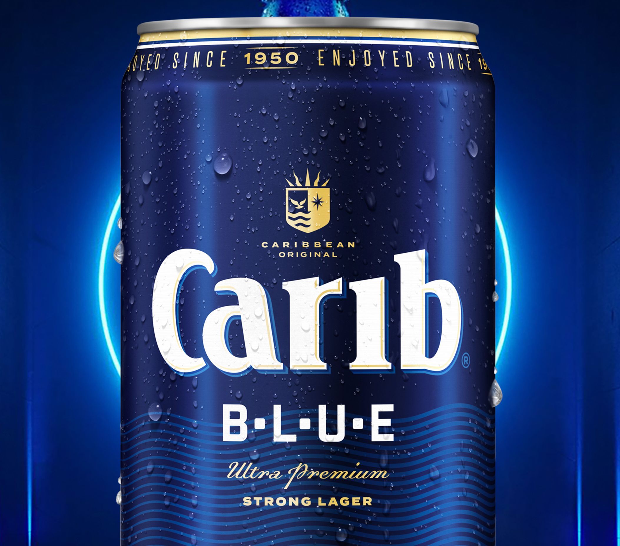 Close-up of a blue aluminum can of Carib Beer Blue with condensation droplets, highlighting its label and design.