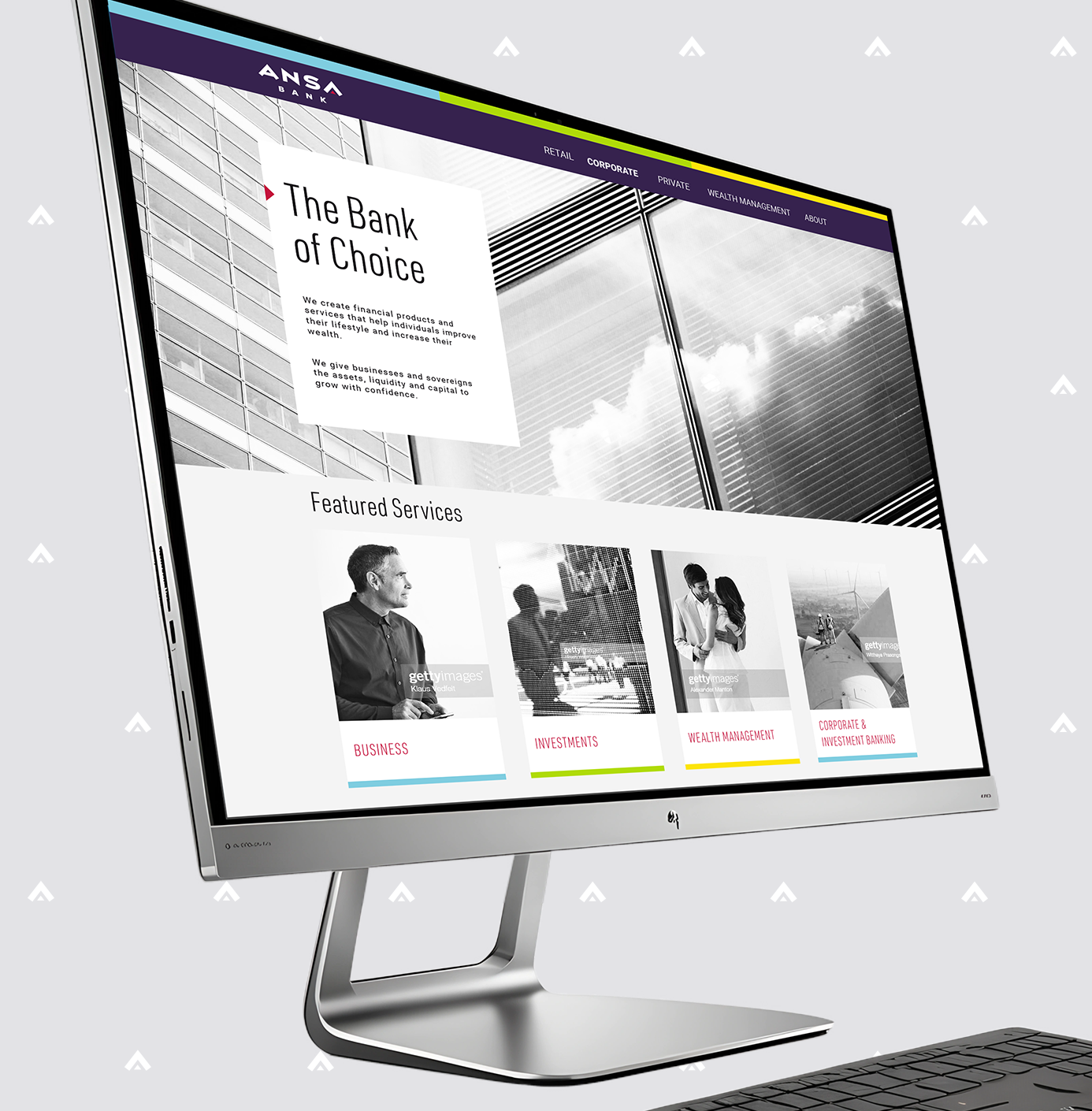 A modern desktop computer displaying a banking website with a skyscraper background, navigation menu, and featured services section with images and labels for business, investments, wealth management, and corporate investment banking.