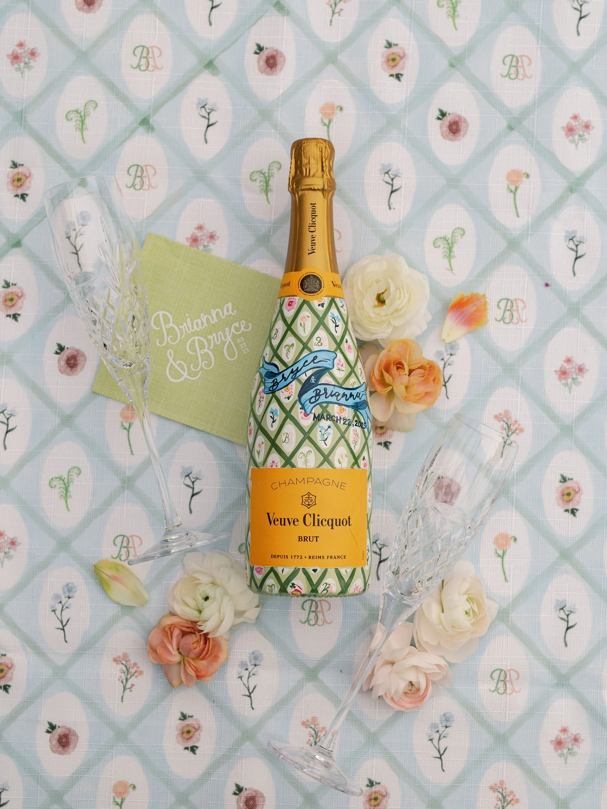 Custom monogrammed champagne label and patterned wedding details designed by Merci Studio for Brianna and Bryce.