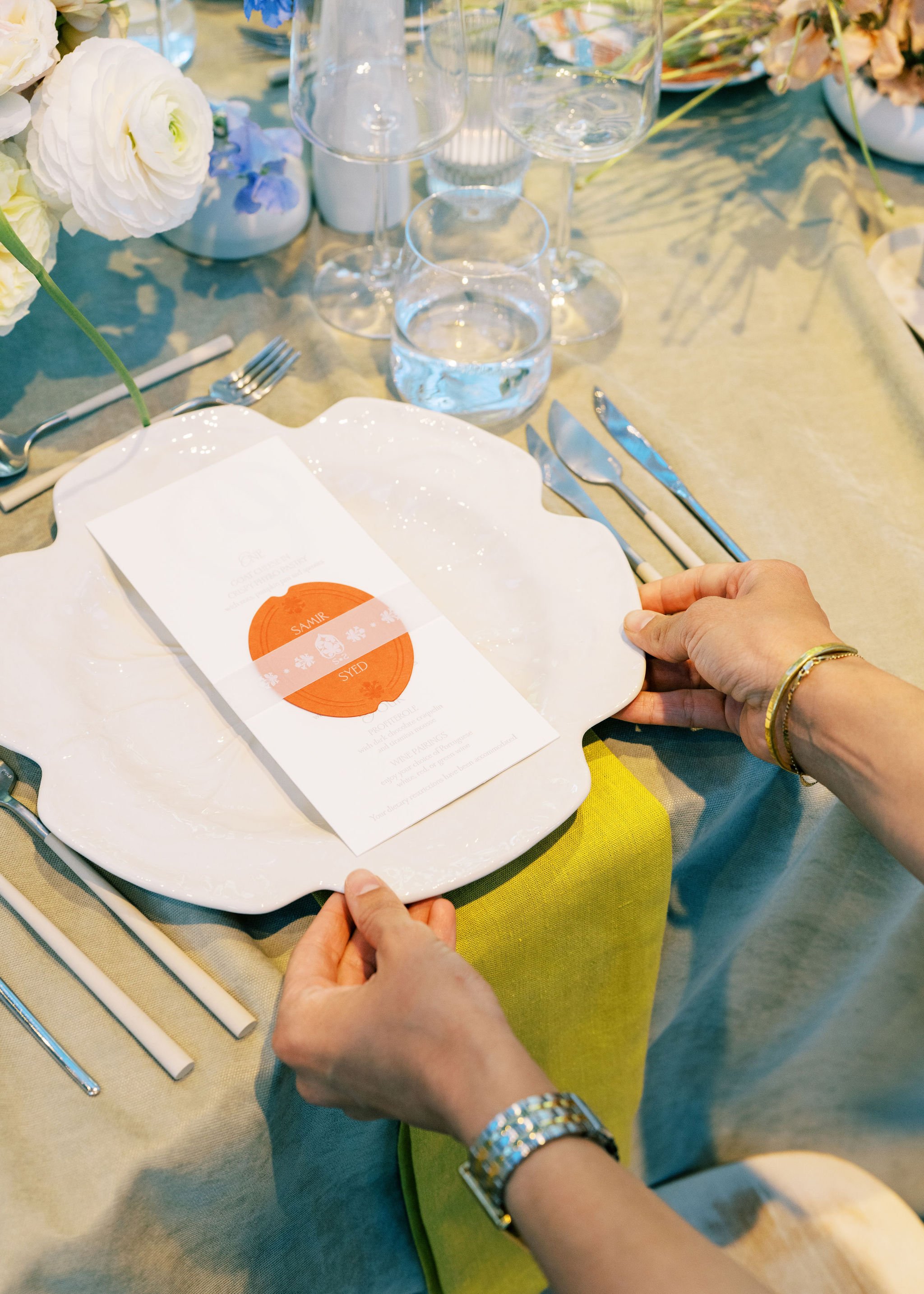 Custom wedding menu designed by Merci Studio as part of a bespoke reception place setting.