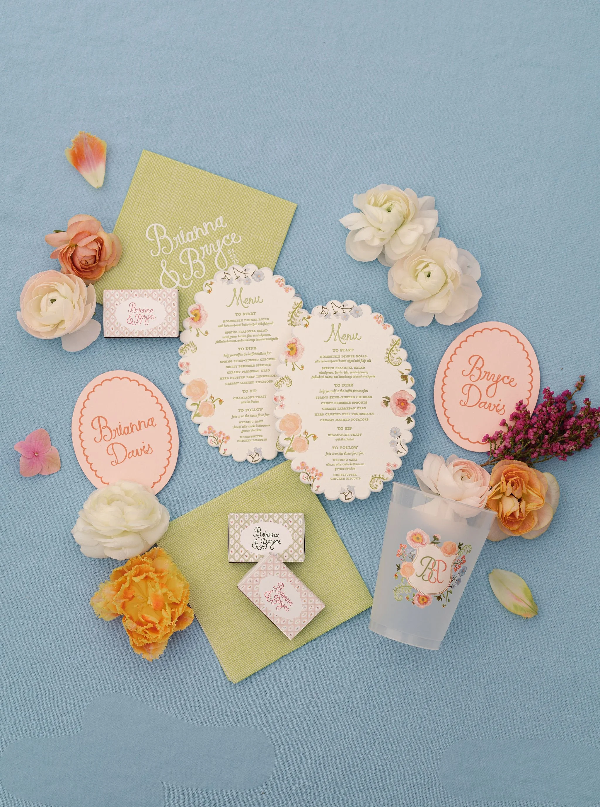Custom wedding menus, place cards, and illustrated details created by Merci Studio for Brianna and Bryce.