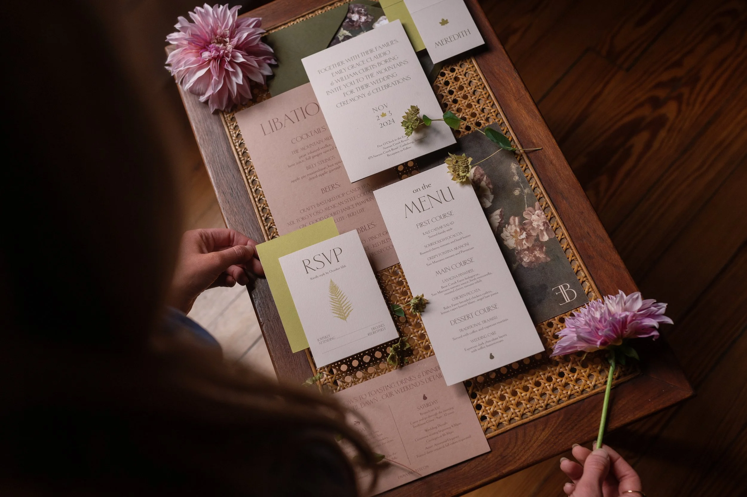 Custom wedding invitation suite with RSVP card and botanical details designed by Merci Studio.