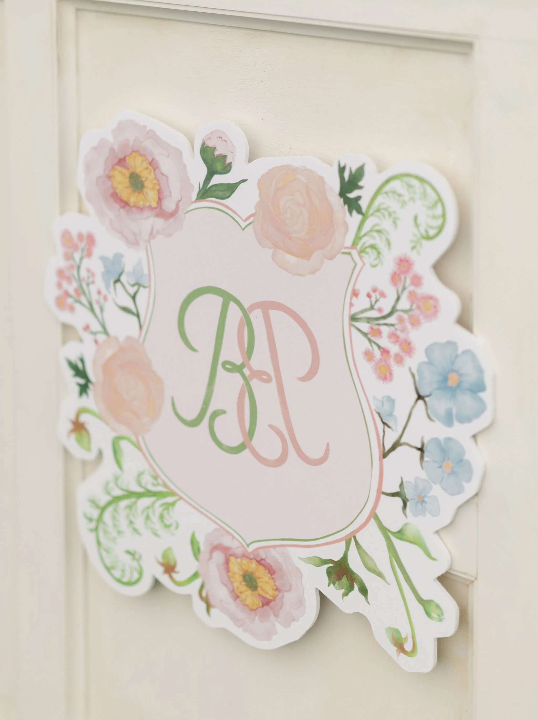 Custom floral artwork and hand-drawn lettering created by Merci Studio for wedding branding.